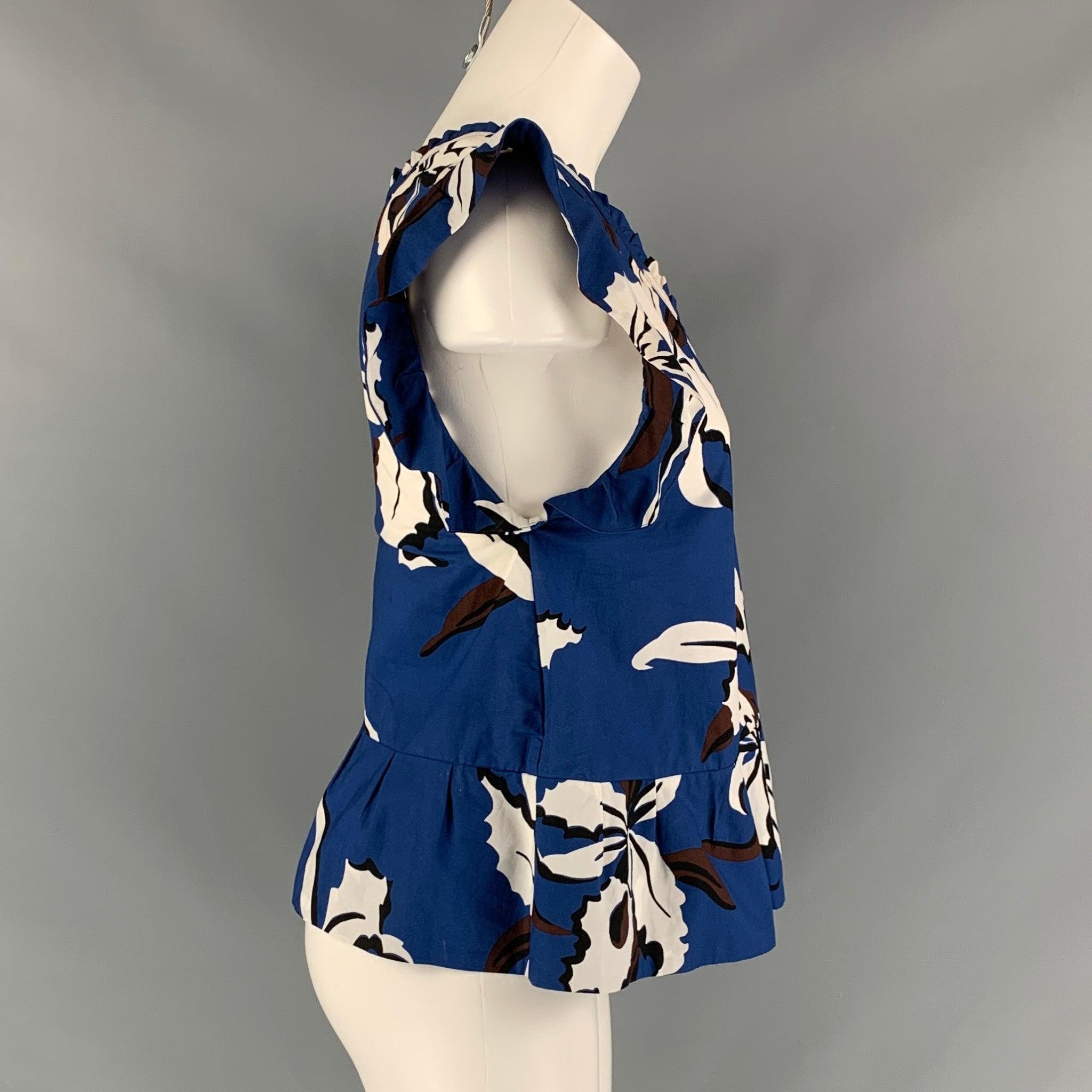 MARNI blouse comes in a blue and white floral cotton poplin featuring a ruffled sleeve, and ruffled detail at neck. Made in Portugal.Excellent Pre-Owned Condition. 

Marked:   36 

Measurements: 
 
Shoulder: 13 inches Bust: 34 inches Length: 20.5