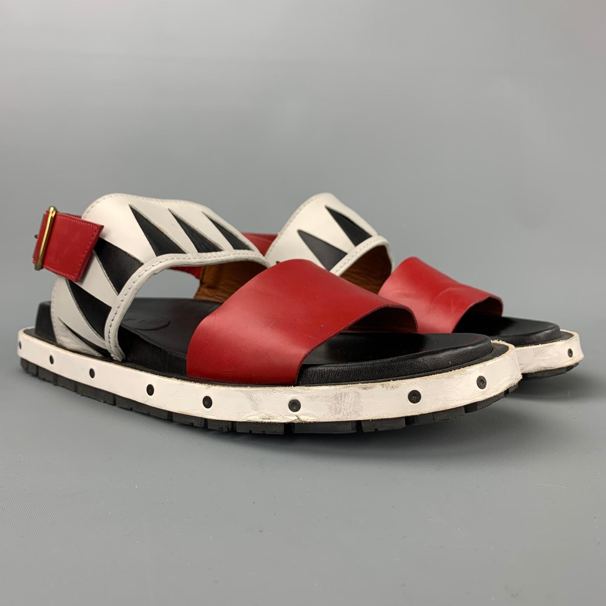 MARNI sandals comes in a red & white leather with a black trim featuring a belted strap closure and a rubber sole. Moderate wear. Made in Italy.

Very Good Pre-Owned Condition.
Marked: EU 43

Outsole: 12 in. x 5 in.