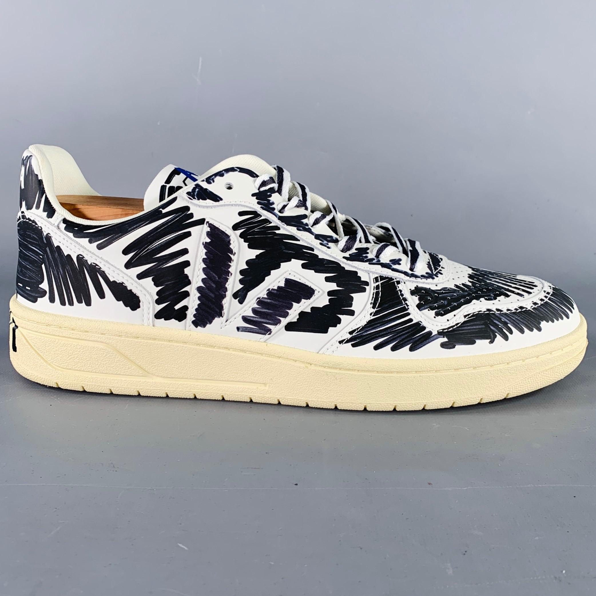 MARNI x VEJA sneakers in a white & black leather with a scribble print throughout featuring a high-top style, rubber sole, and a lace up closure. Shoe trees not included. Made in Brazil.New with Box. 

Marked:   10.5Outsole: 12 inches  x 4 inches  
