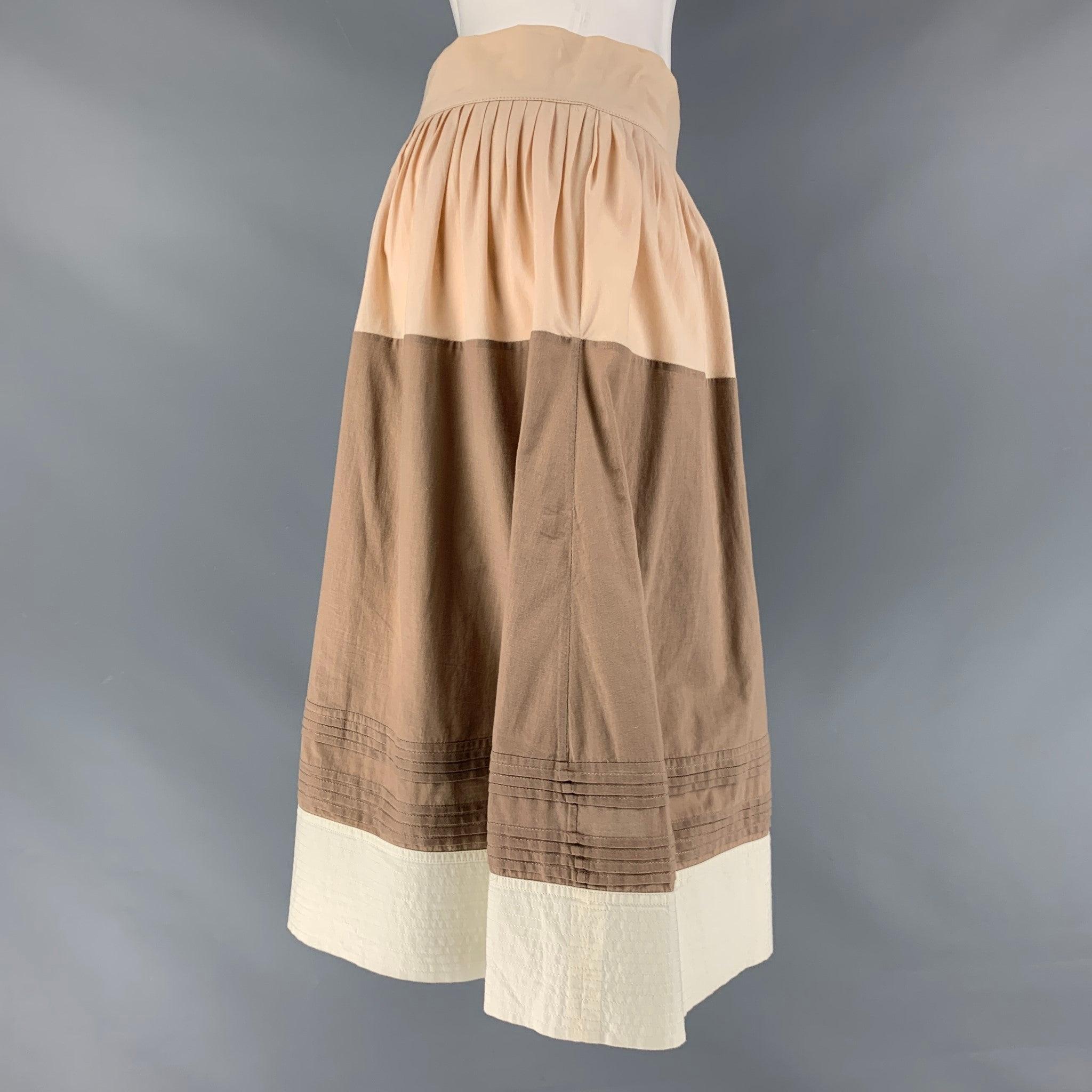 MARNI skirt comes in a beige and brown cotton featuring a pleated style, tie closure at side. Made in Italy.Excellent Pre-Owned Condition. 

Marked:  
38 

Measurements: 
  Waist: 27 inches Hip: 42 inches Length: 24 inches  
  
  
 
Reference: