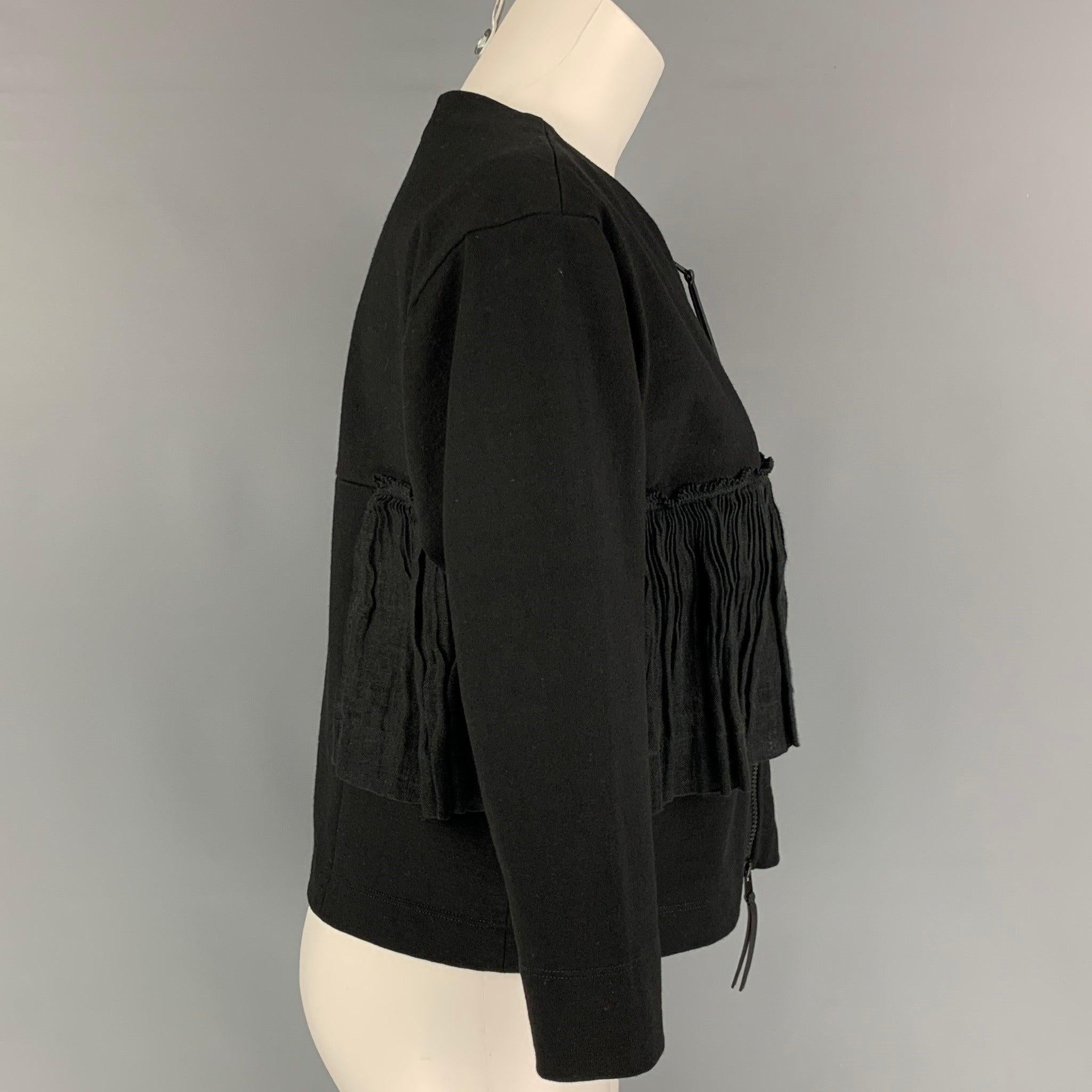 MARNI jacket comes in a black cotton / flax featuring a ruffled detail, 3/4 sleeves, and a front zipper closure. Made in Italy.
Very Good
Pre-Owned Condition. 

Marked:   38 

Measurements: 
 
Shoulder: 17.5 inches  Bust: 36 inches  Sleeve: 17.5