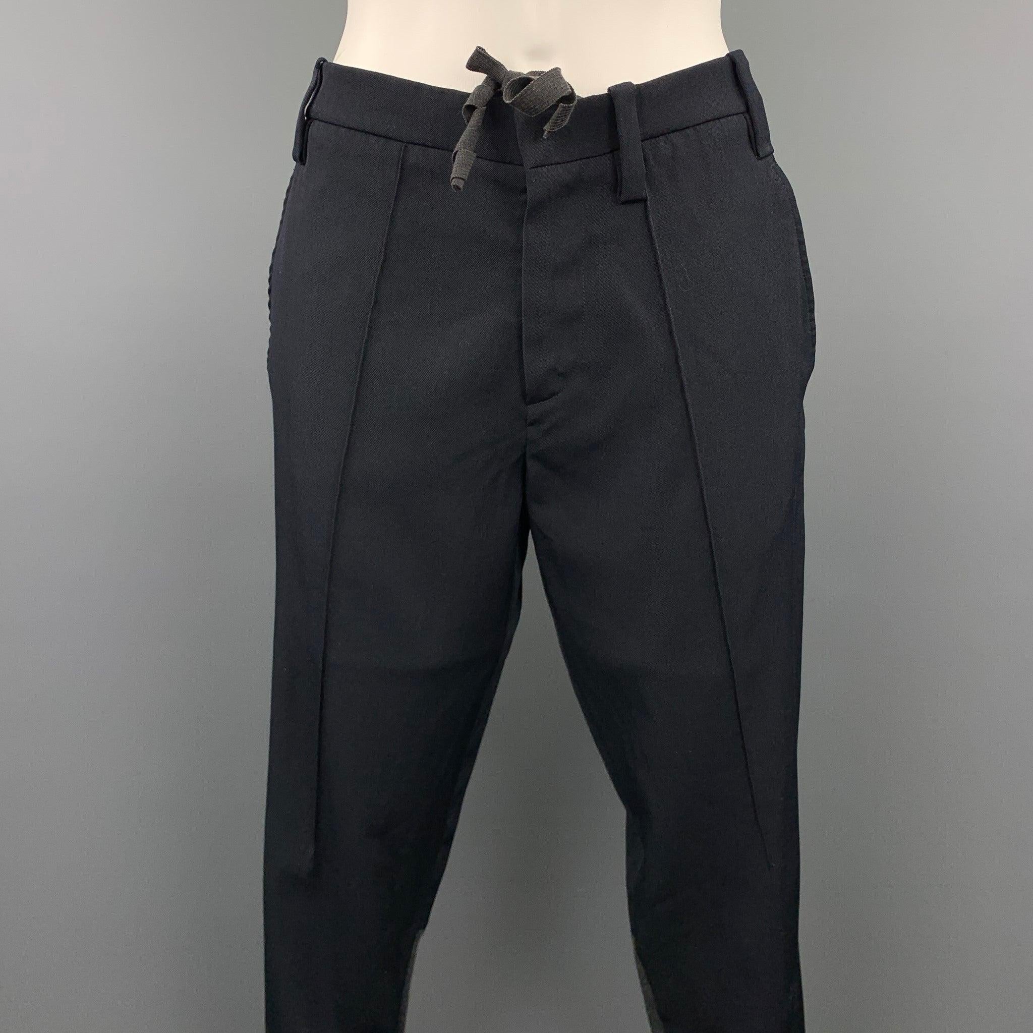 MARNI casual pants comes in a black virgin wool with a knitted patch featuring a skinny fit, draw string, and a zip up closure. Made in Portugal.Good
Pre-Owned Condition. 

Marked:   38 

Measurements: 
  Waist: 32 inches 
Rise: 8.5 inches 
Inseam: