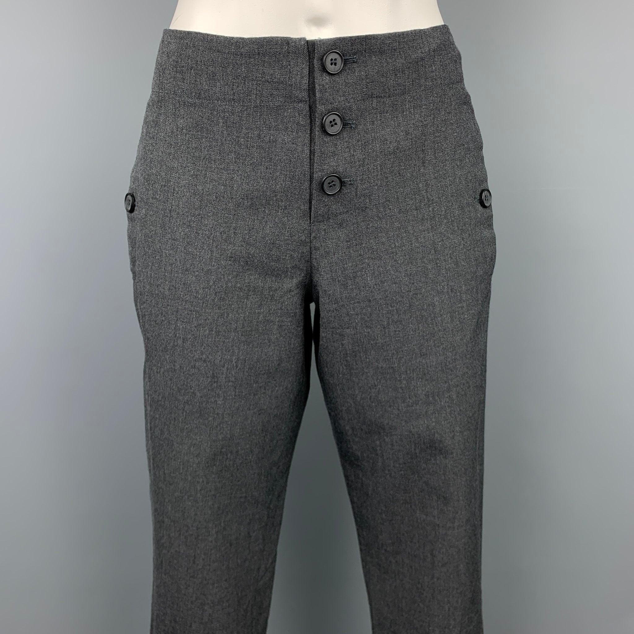 MARNI casual pants comes in a grey virgin wool featuring a cropped style, buttoned pockets, drawstring, and a button fly closure. Made in Portugal.Very Good
Pre-Owned Condition. 

Marked:   38 

Measurements: 
  Waist: 32 inches  Rise: 8 inches 