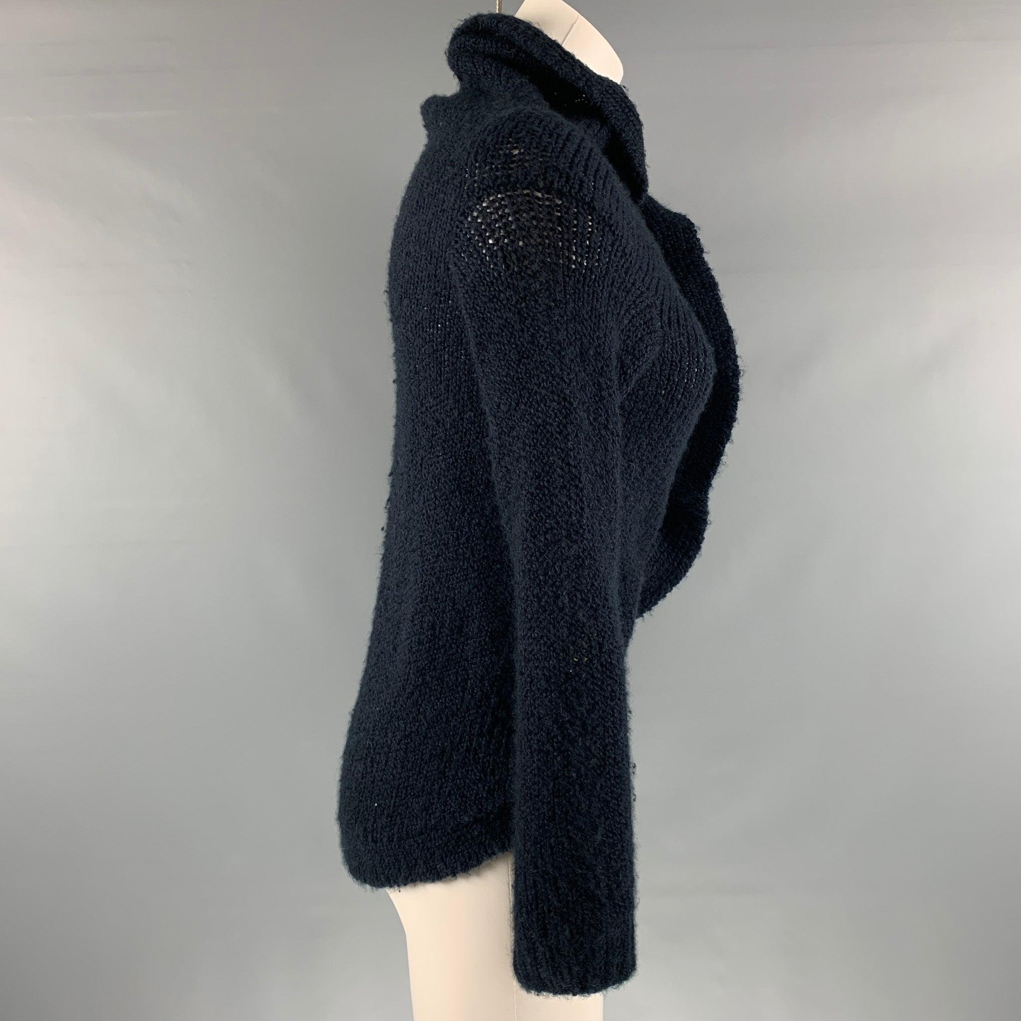 MARNI cardigan comes in a navy knitted material featuring an asymmetrical style, and button up closure. Made in Italy.Very Good Pre-Owned Condition. Moderate signs of wear and piling. 

Marked:   38 

Measurements: 
 
Shoulder: 17 inches  Bust: 42