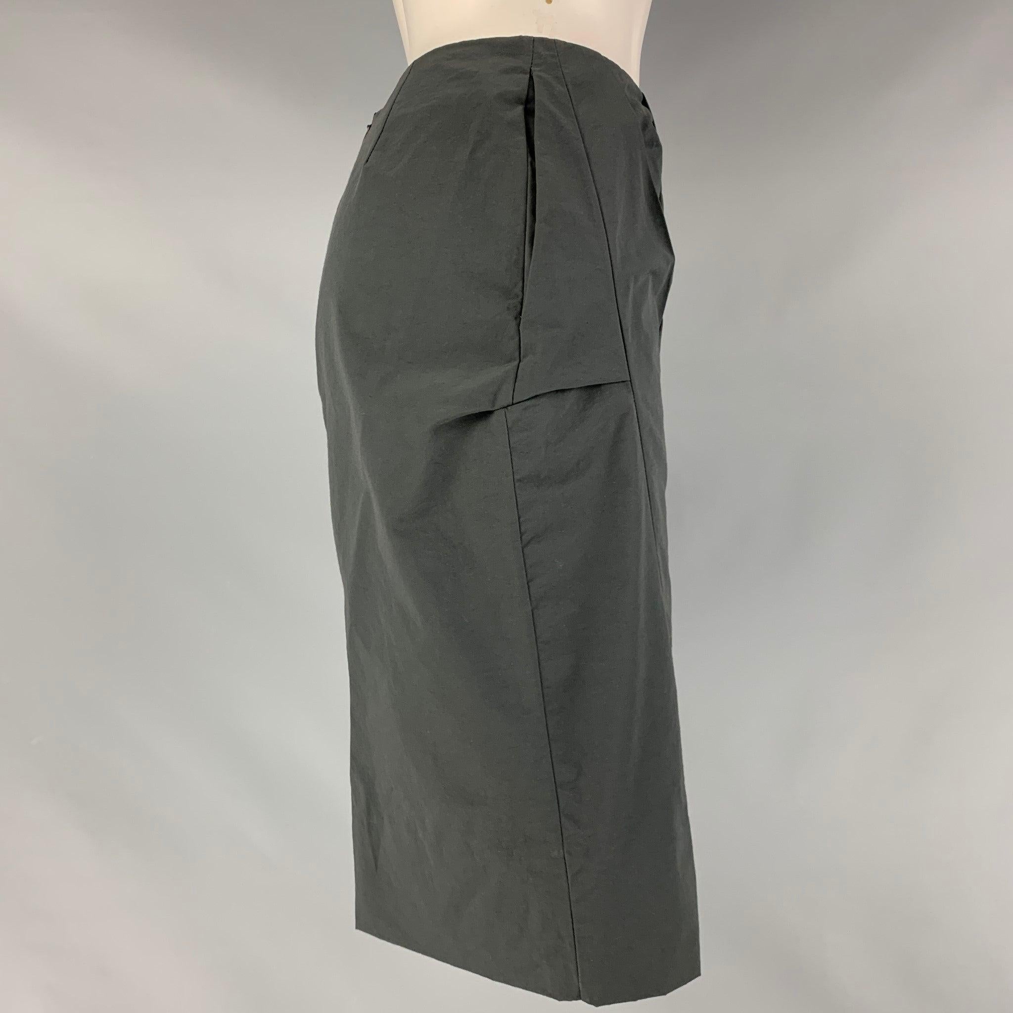 MARNI pencil skirt comes in a slate cotton and nylon fabric featuring an abstract pleats at front, frontal pockets, and a back zipper closure. Made in Italy.Excellent Pre-Owned Condition. 

Marked:   38 

Measurements: 
  Waist: 26 inches Hip: 35