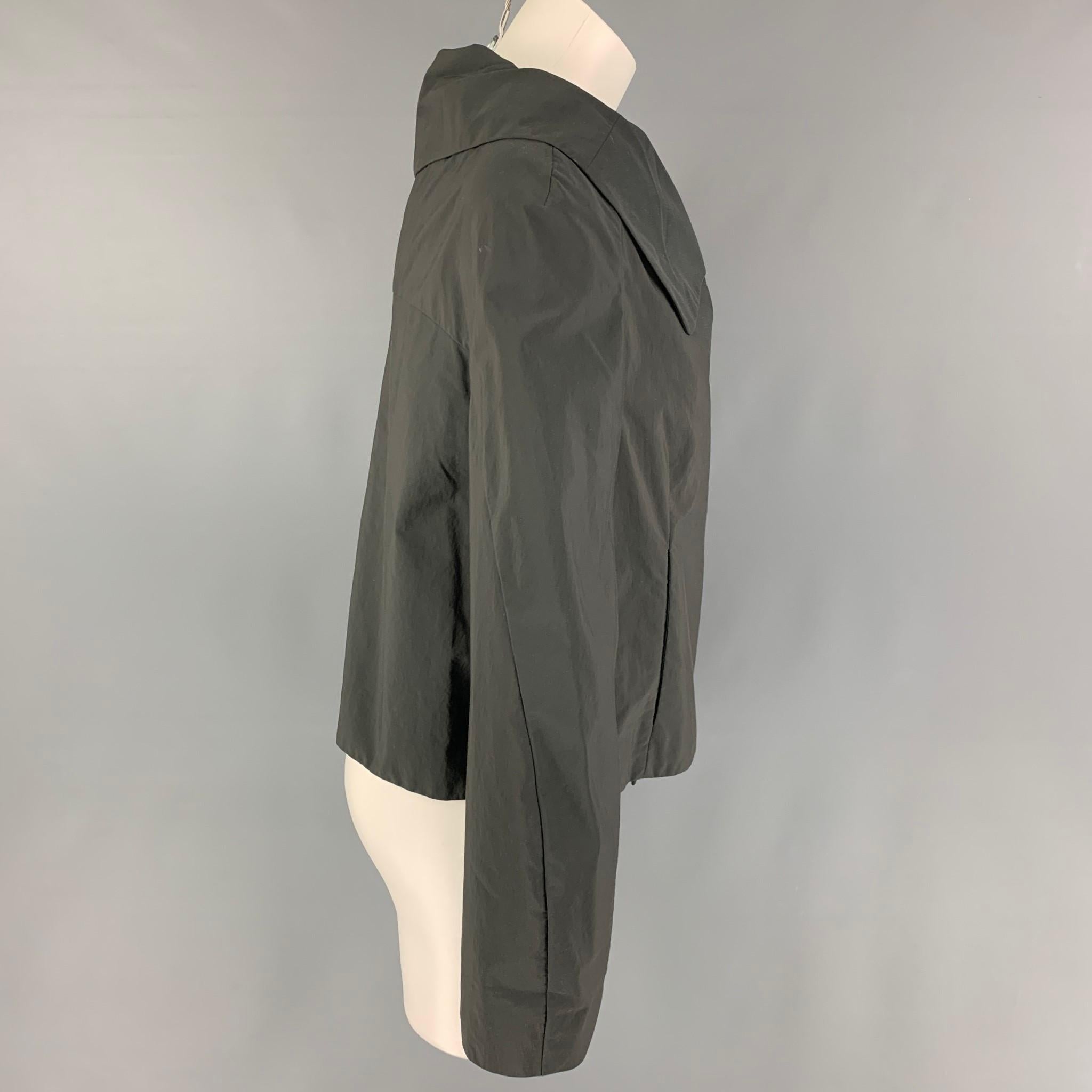 MARNI jacket comes in a slate cotton / nylon featuring a large collar, slit pockets, and a double breasted snap button closure. Made in Italy. 

Very Good Pre-Owned Condition.
Marked: 38

Measurements:

Shoulder: 16 in.
Bust: 37 in.
Sleeve: 25