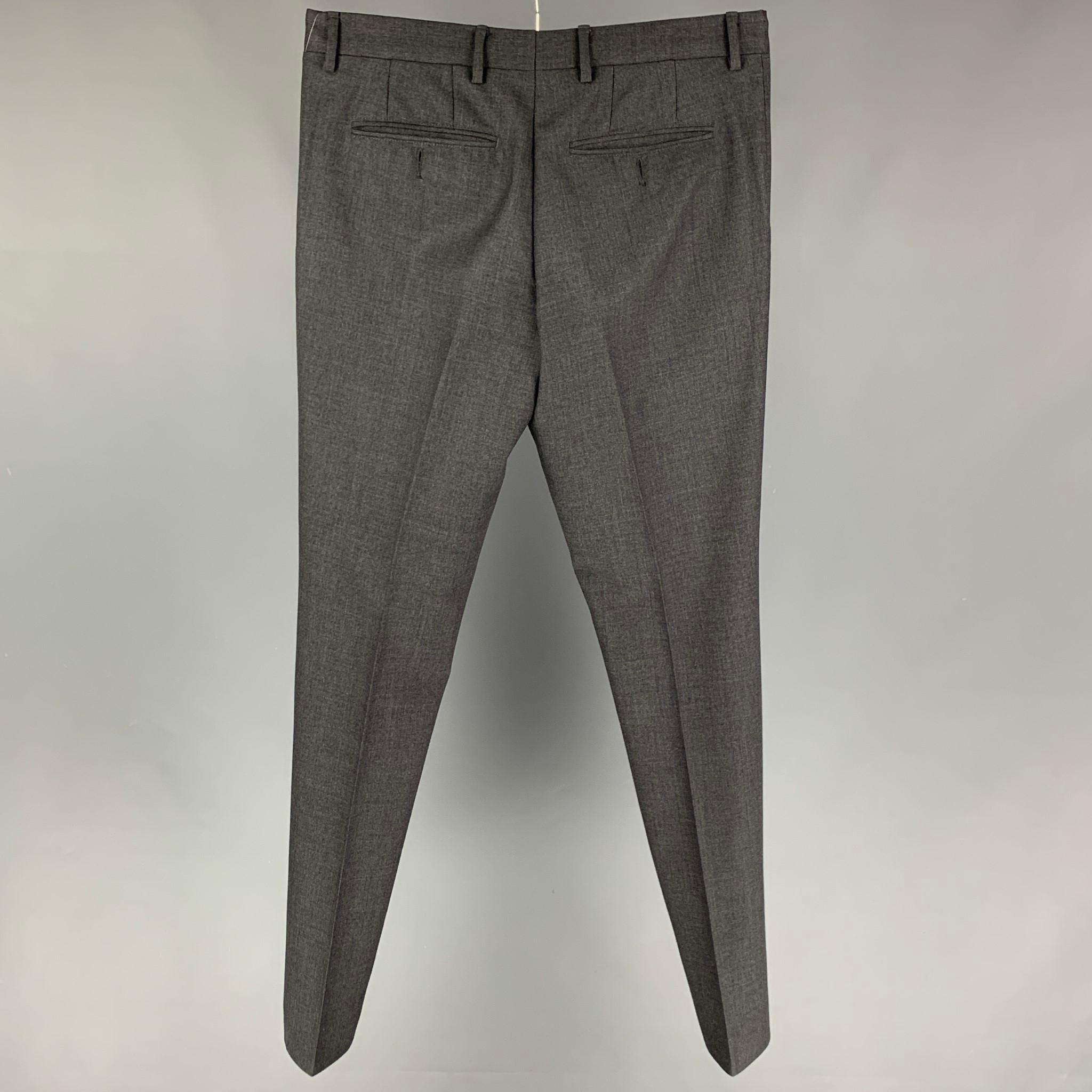 MARNI dress pants comes in a grey cotton featuring a flat front, front tab, and a button fly. Made in Italy. 

Very Good Pre-Owned Condition.
Marked: 48

Measurements:

Waist: 32 in.
Rise: 10 in.
Inseam: 33 in. 