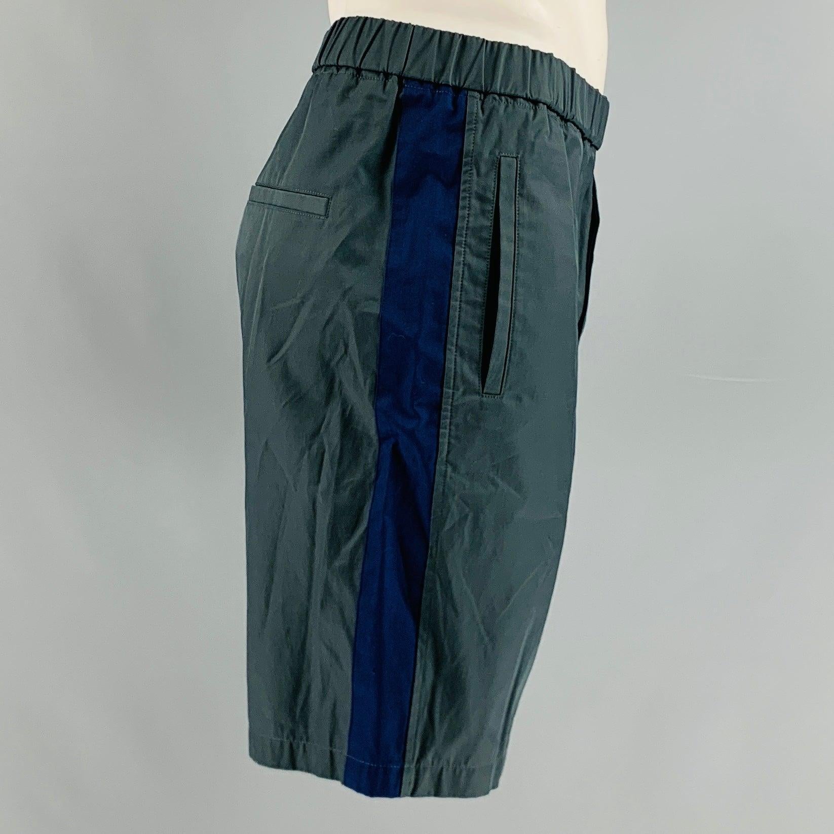 MARNI shorts comes in a grey and blue cotton blend featuring a vertical stripe at side seam, front pockets, and elastic waistband..
Excellent Pre-Owned Condition. 

Marked:   50 

Measurements: 
  Waist: 34 inches Rise: 10 inches Inseam: 8.5 inches 