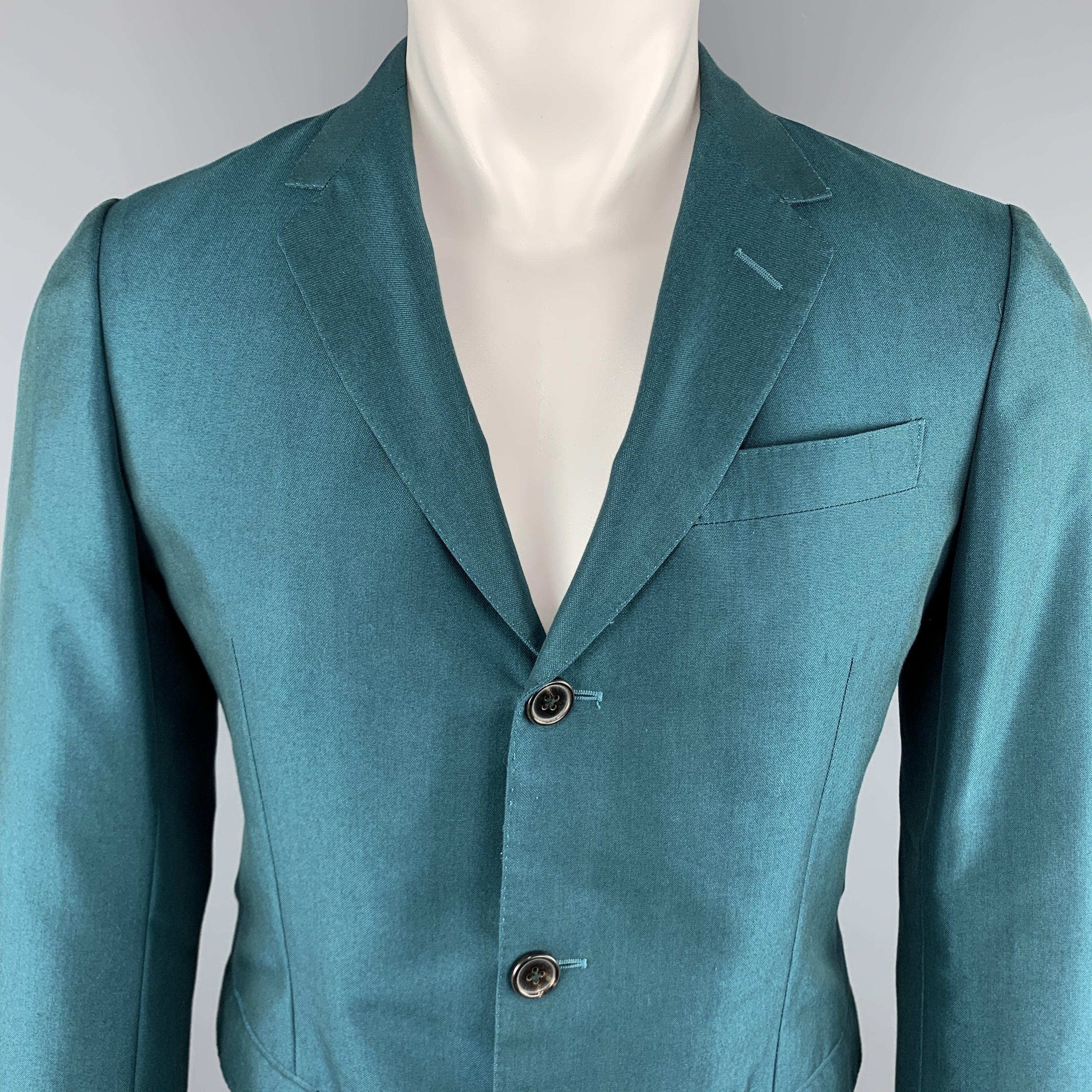 MARNI
Sport Coat comes in a teal tone in a solid wool material, with a notch lapel, slit and flap pockets, three buttons at closure, single breasted, a single vent at back, and functional buttons at cuffs.
Excellent Pre-Owned Condition. 

Marked:  