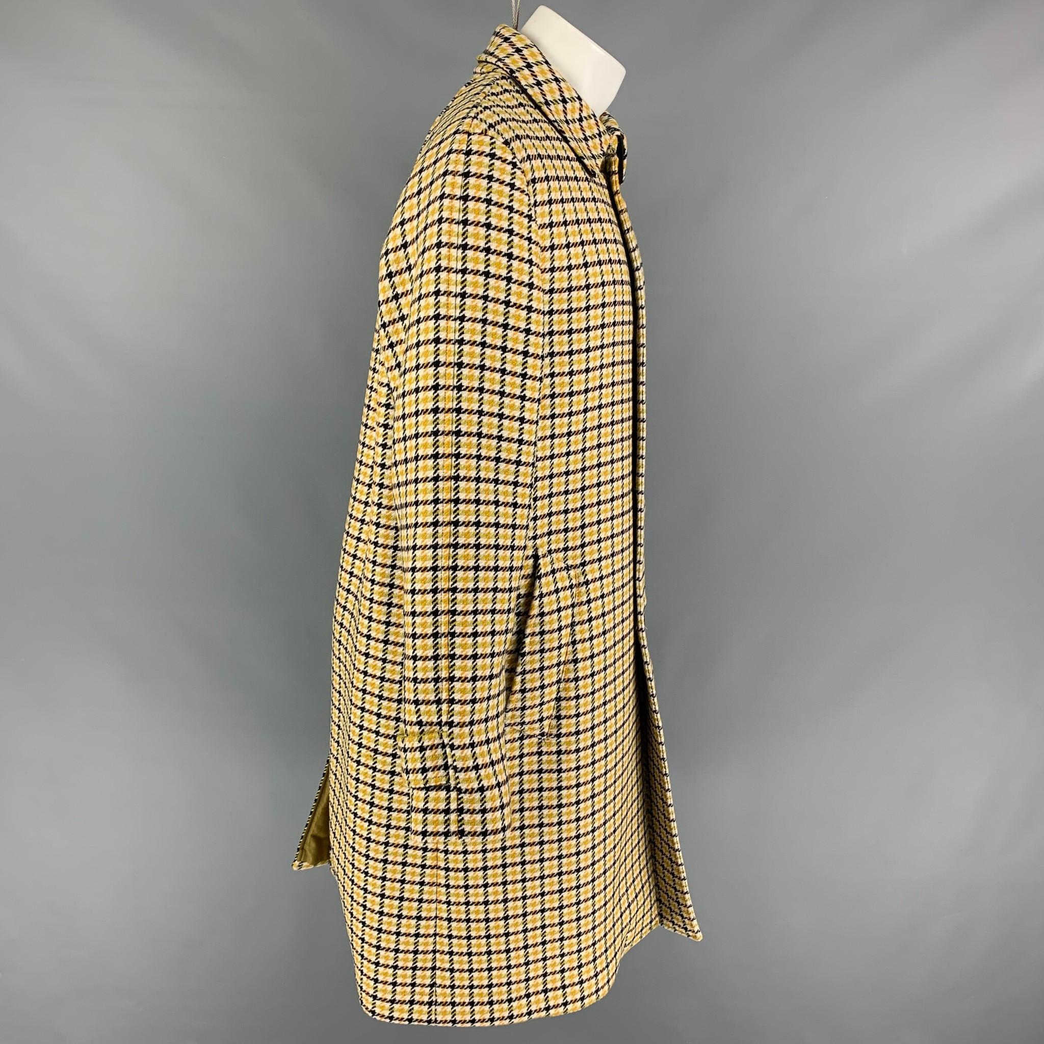 MARNI coat comes in yellow & black plaid wool wth a full liner featuring a loose fit, spread collar, leather trim, slit pockets, and a buttoned closure. Made in Italy. 

Excellent Pre-Owned Condition.
Marked: 48
Original Retail Price: