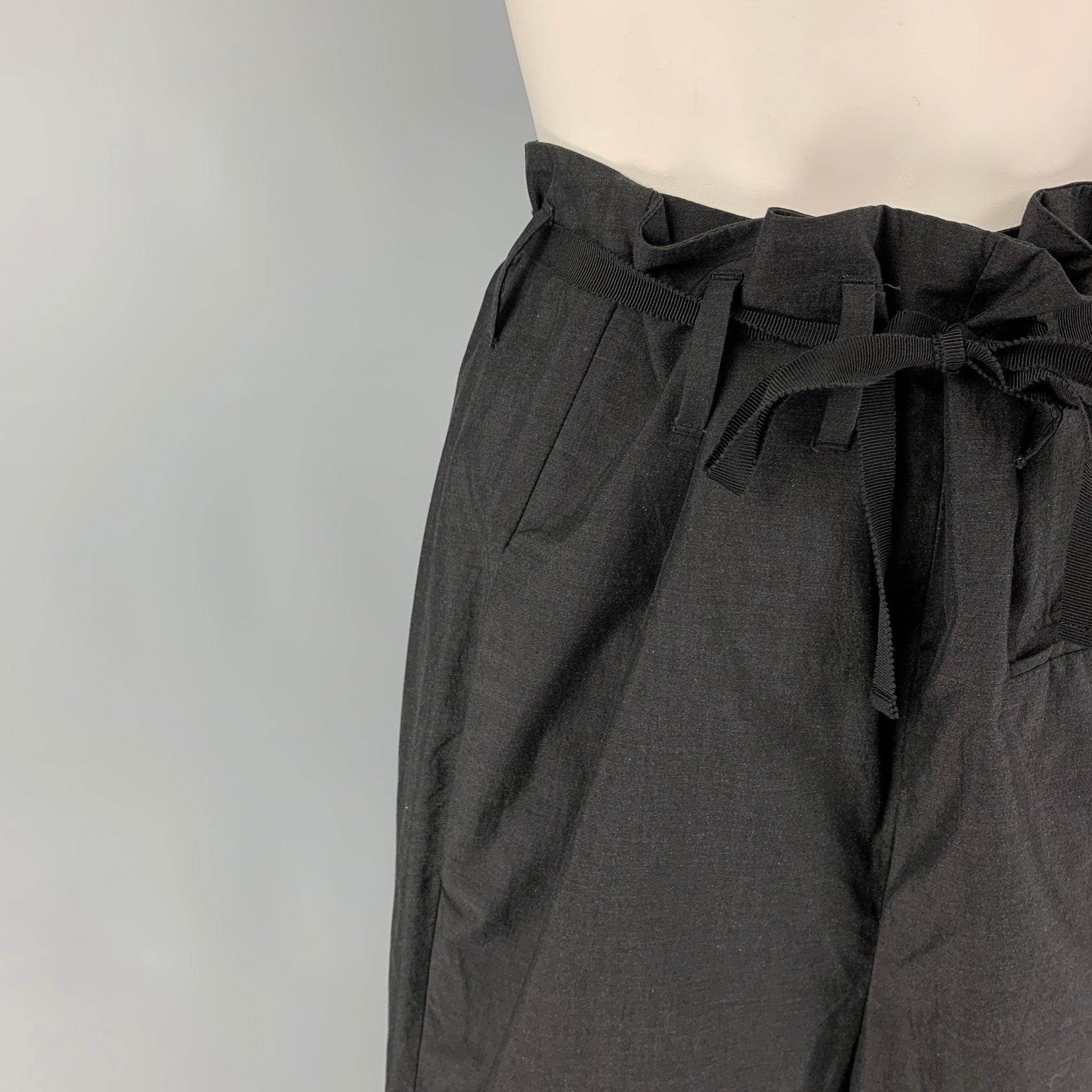 MARNI dress pants comes in a black cotton featuring a high waisted style, ruffled waist detail, ribbon belt detail, and a button fly closure. Made in Italy.
Excellent
Pre-Owned Condition. 

Marked:   40 

Measurements: 
  Waist: 30 inches Rise: 15