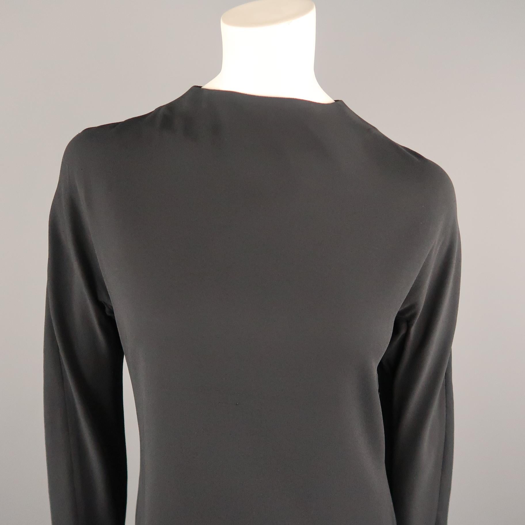 MARNI shift dress comes in black stretch crepe with a high neck, long sleeves, A line silhouette, and zip up back. Made in Portugal.
 
Good Pre-Owned Condition.
Marked: IT 40
 
Measurements:
 
Shoulder: 17 in.
Bust: 38 in.
Waist: 33 in.
Hip: 38