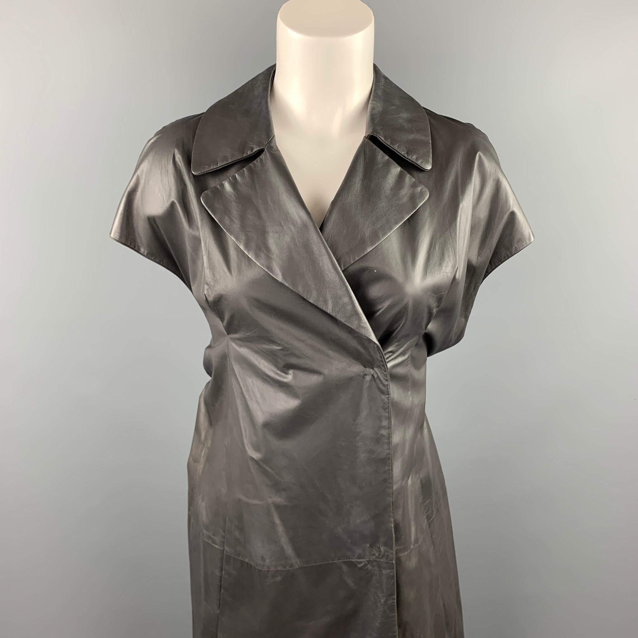 MARNI vest comes in a grey leather featuring a notch lapel, slit pockets, back belt, and a double breasted closure. Minor wear. As-Is. Made in Italy.

Good Pre-Owned Condition.
Marked: IT 40

Measurements:

Shoulder: 17.5 in. 
Bust: 34 in. 
Sleeve: