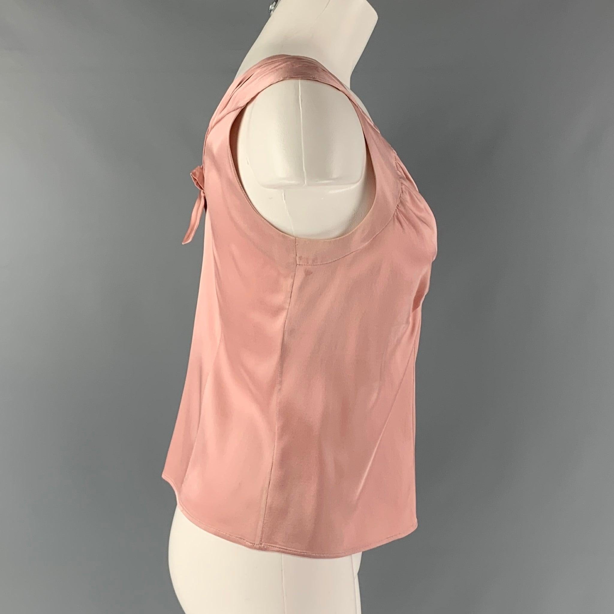MARNI top comes in a pink silk and elastane sateen fabric featuring a V-neck and a bow detail at center back. Made in Italy. Very Good Pre-Owned Condition. Minor discoloration under the shoulder.  

Marked:   40 

Measurements: 
 
Shoulder: 15