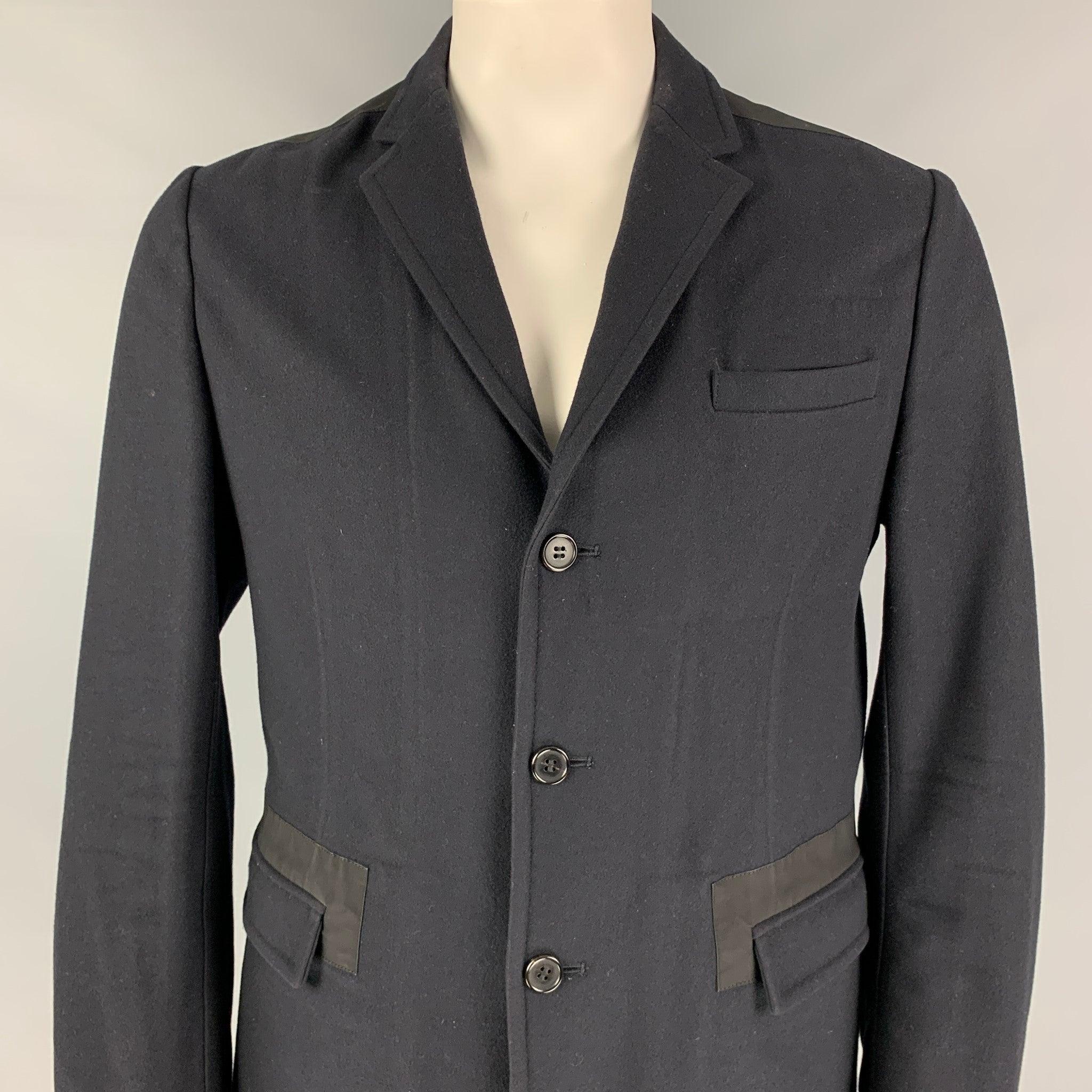 MARNI sport coat comes in a navy & black wool blend featuring a notch lapel, flap pockets, single back vent, and a three button closure. Made in Italy. Very Good Pre-Owned Condition. 

Marked:   50 

Measurements: 
 
Shoulder: 18 inches  Chest: 42
