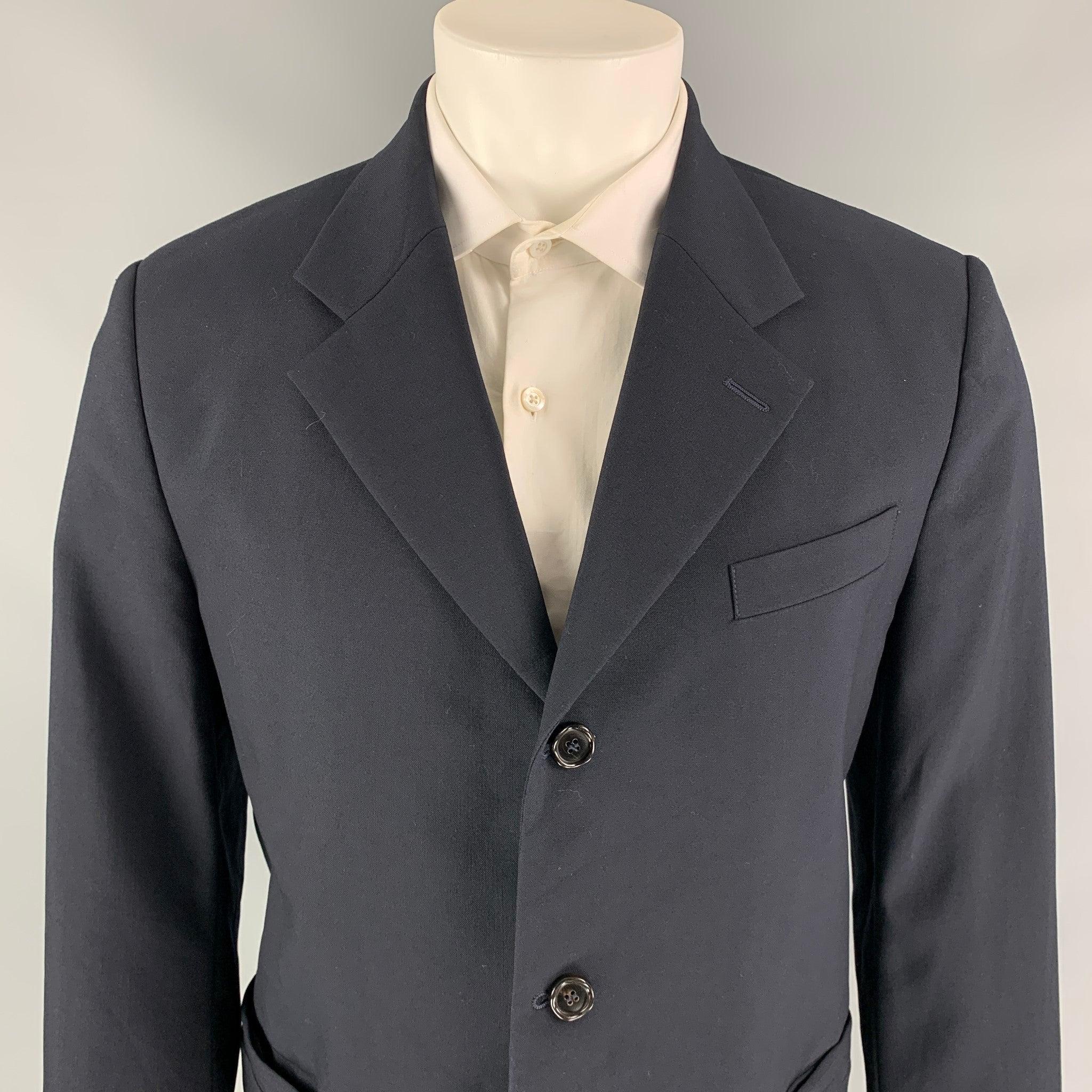 MARNI sport coat comes in a navy wool with a full liner featuring a notch lapel, slit pockets, and a three button closure. Made in Italy.Very Good
Pre-Owned Condition. 

Marked:   50  

Measurements: 
 
Shoulder: 17.5 inches  Chest: 42 inches 