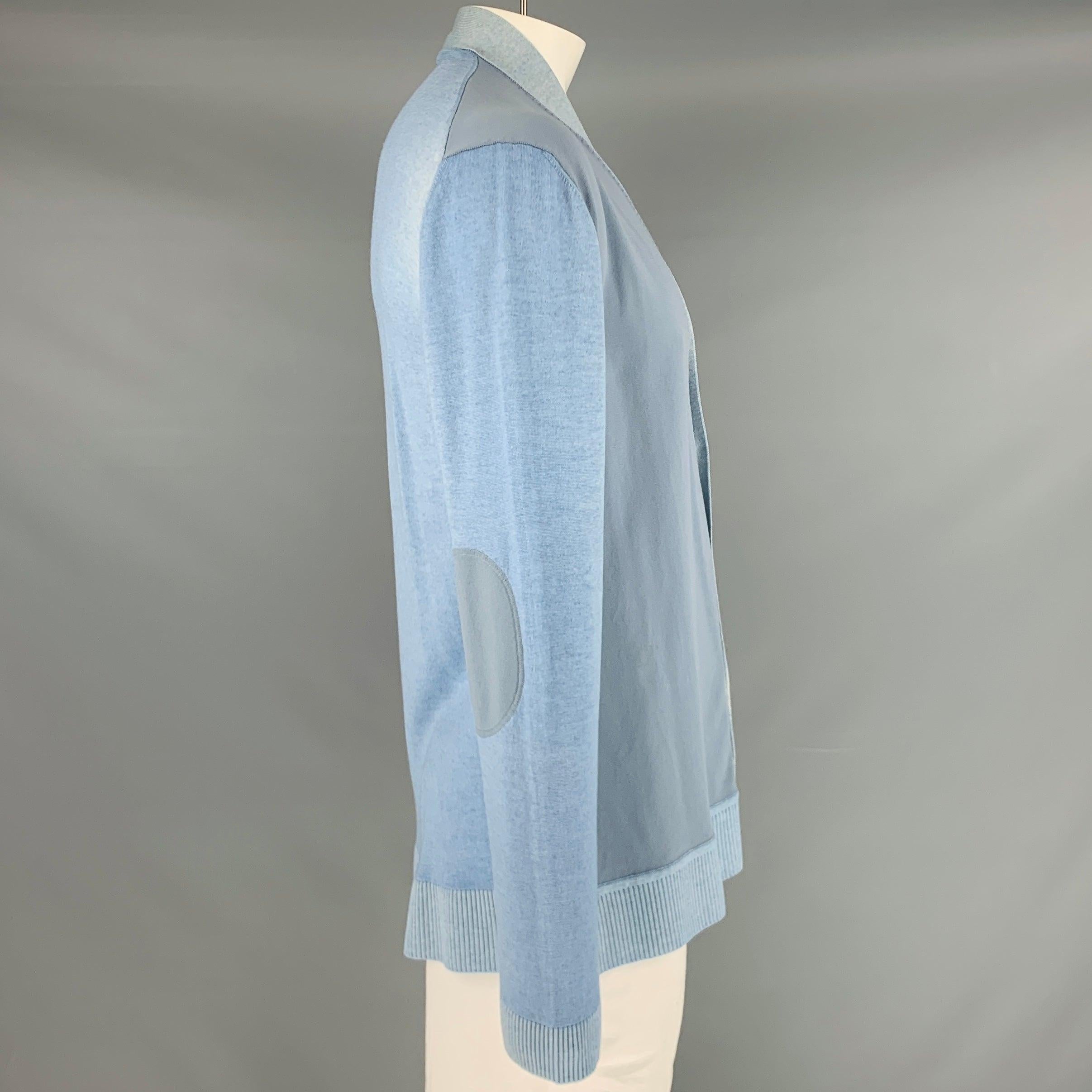 MARNI cardigan
in a blue wool blend knit featuring elbow patches, V-neck, and button closure. Made in Italy.Very Good Pre-Owned Condition. Moderate signs of wear. 

Marked:   54 

Measurements: 
 
Shoulder: 22 inches Chest: 44 inches Sleeve: 27.5