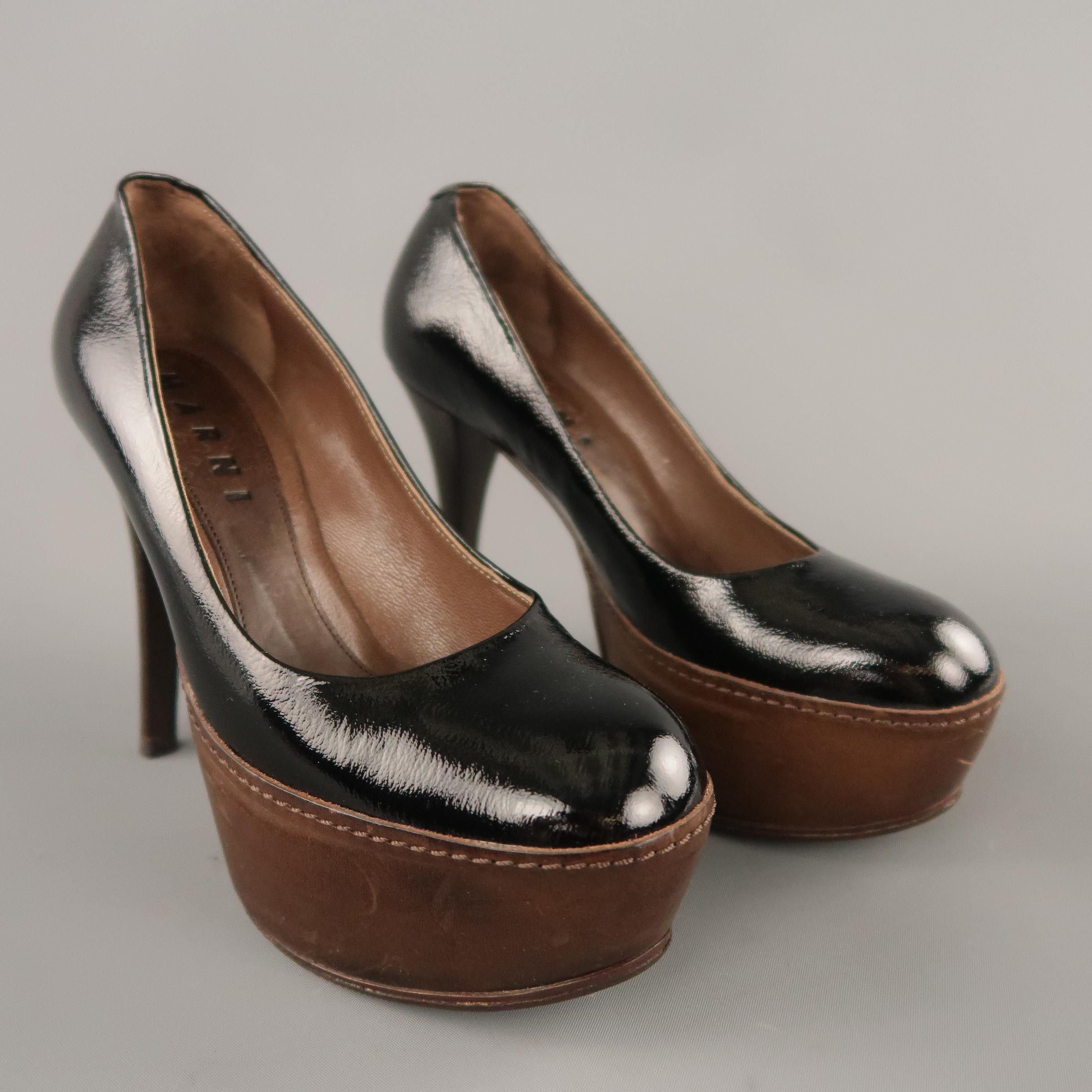 MARNI pumps come in black patent leather with a round toe, brown leather covered platform, and stacked stiletto heel. Made in Italy.

Original retail price $695.00
 
Very Good Pre-Owned Condition.
Marked: IT 35.5
 
Measurements:
 
Heel: 4.5