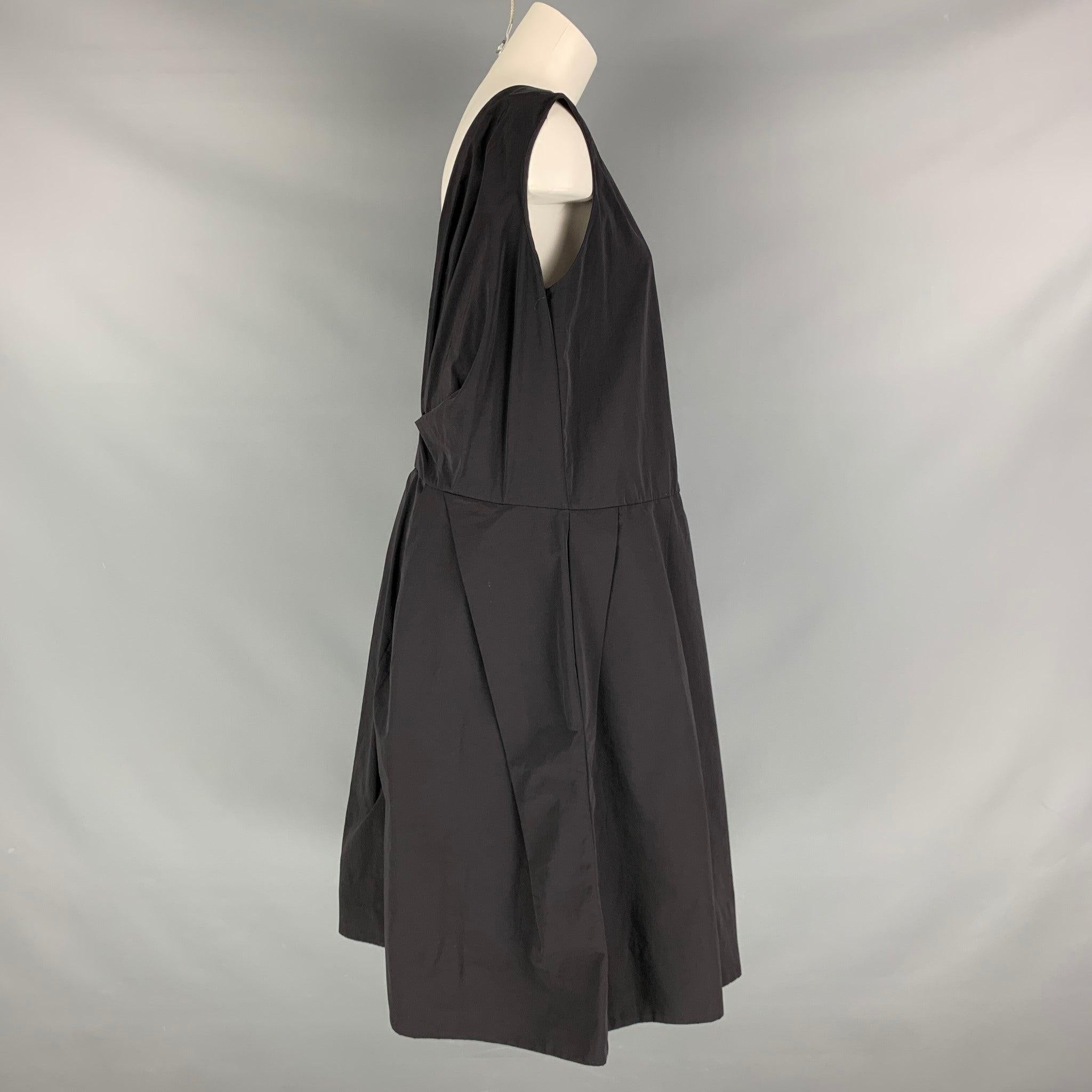 MARNI dress comes in a black cotton and nylon woven material featuring a back drop V design, oversized style, pockets, and sleeveless. Made in Italy.Excellent Pre-Owned Condition. 

Marked:  42 

Measurements: 
 
Shoulder: 16 inches Bust: 40 inches