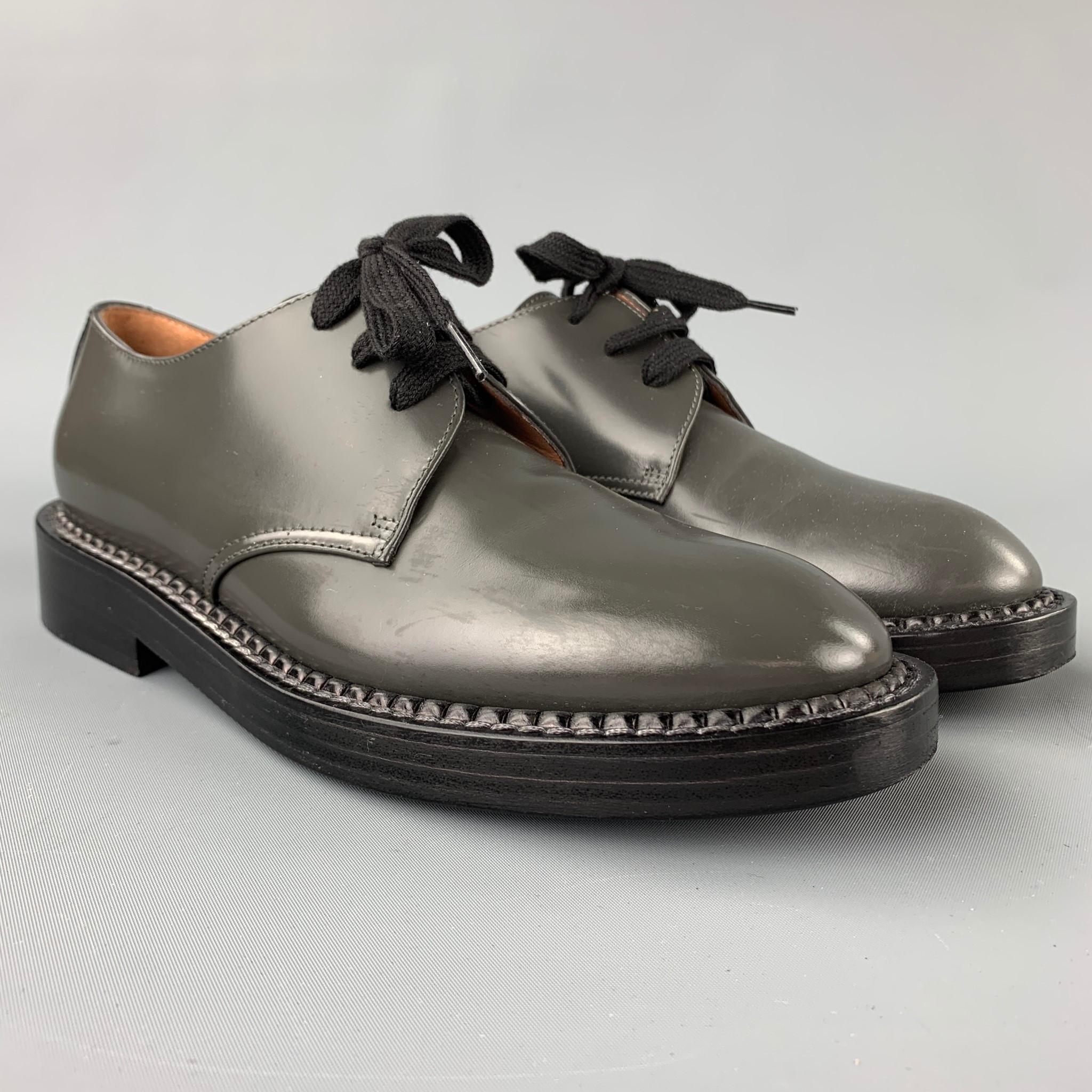 MARNI shoes comes in a slate leather featuring a round toe, thick wooden sole, and a lace up closure. Made in Italy. 

Excellent Pre-Owned Condition.
Marked: EU 36
Original Retail Price: $890.00

Measurements:

10.5 in. x 3.5 in.