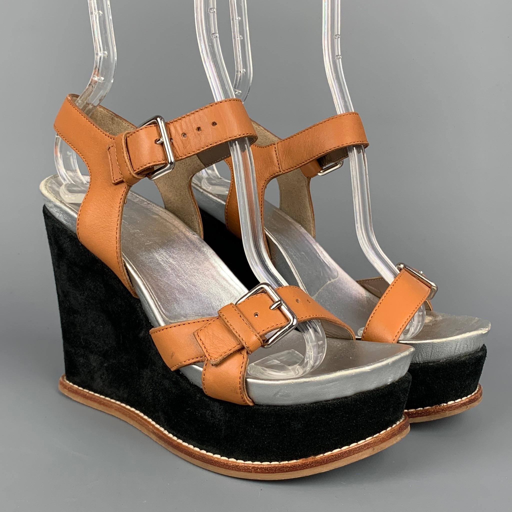 MARNI sandals comes in a tan leather with a silver interior featuring a ankle strap, rubber sole, and a black velvet wedge heel. Made in Italy.

Very Good Pre-Owned Condition.
Marked: Size not visible
Original Retail Price: