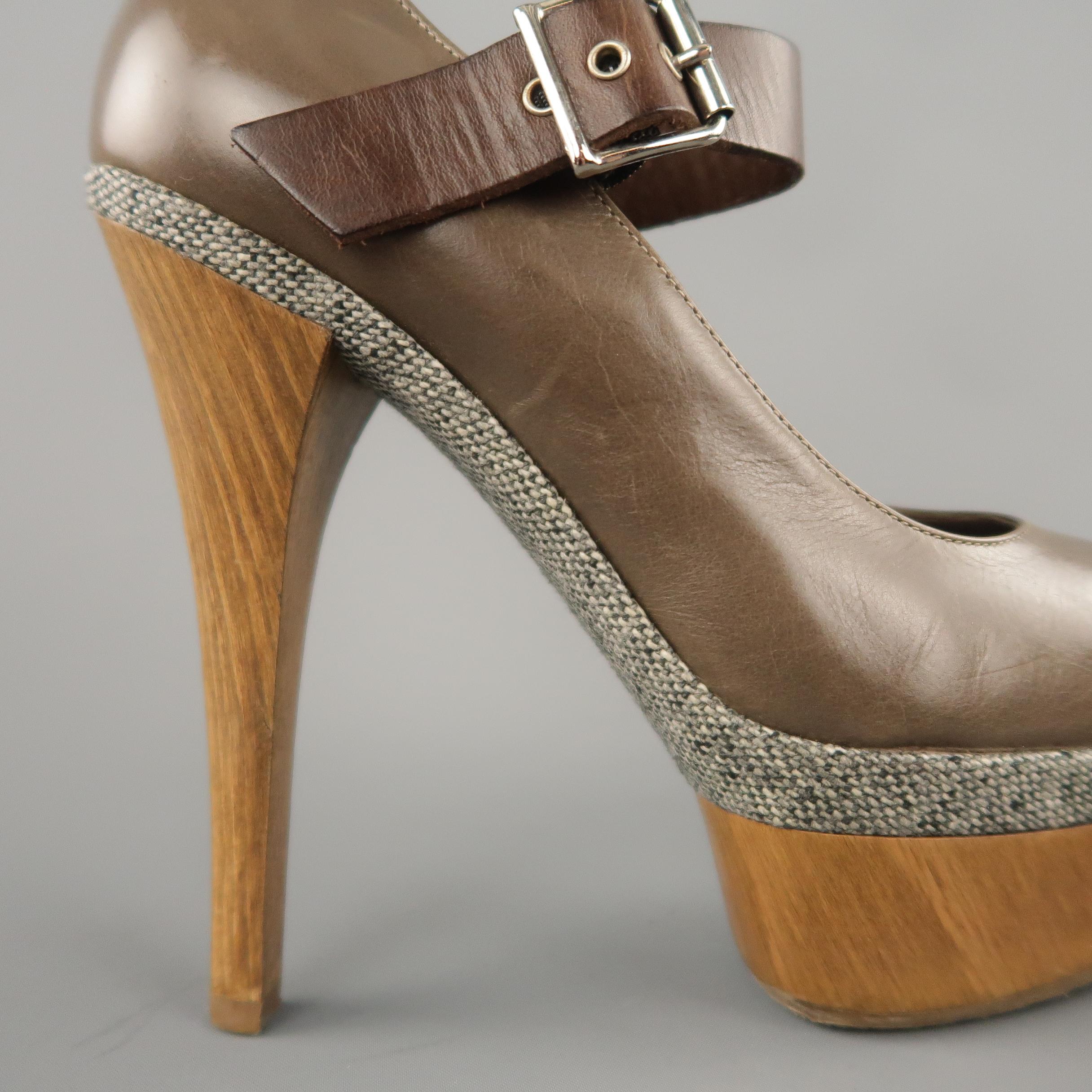 MARNI pumps come in taupe leather with a Mary Jane strap, peep toe, gray tweed mid panel, and wooden platform and heel.
 
Excellent Pre-Owned Condition.
Marked: (no size)
 
Measurements:
 
Heel: 5.45 in.
Platform: 1.5 in.