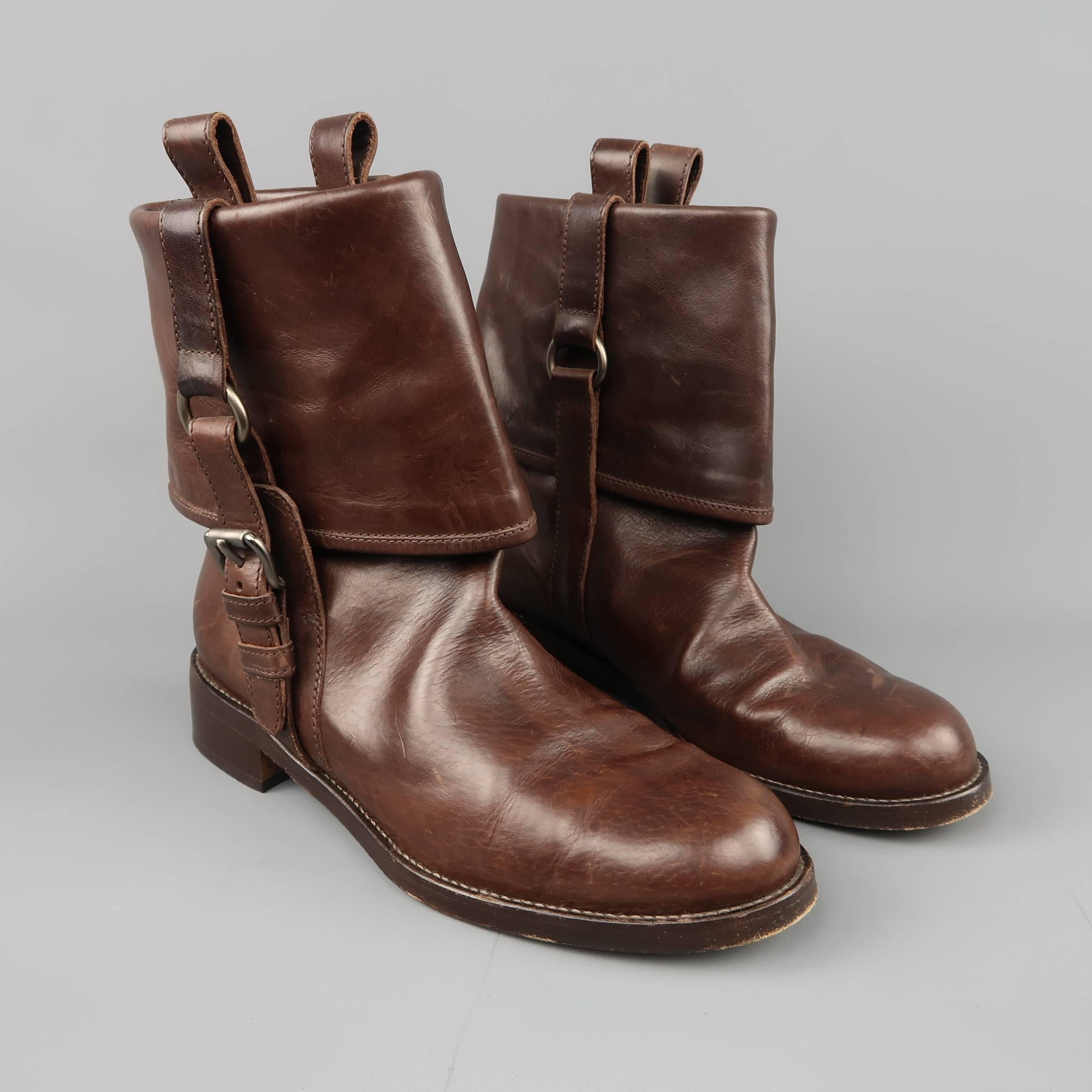 MARNI ankle boots come in brown leather with a rounded toe, low heel, and fold over cuff with harness. Wear throughout. As-is. Made in Italy.
 
Fair Pre-Owned Condition.
Marked: IT 36.5
 
Measurements:
 
Heel: 1 in.
Length: 7 in.