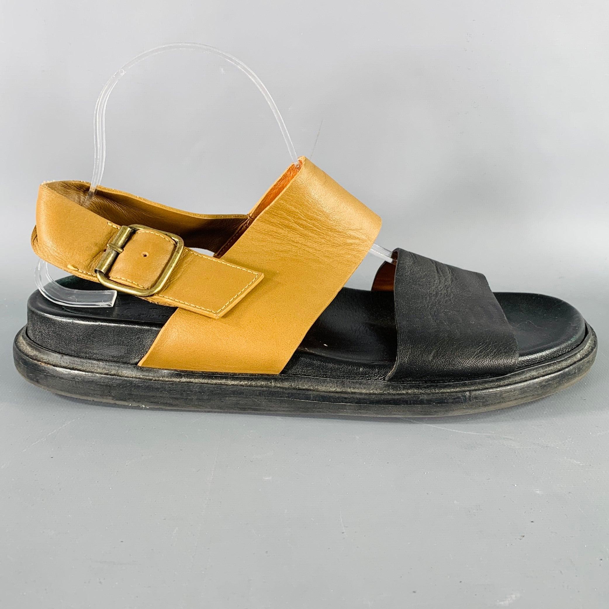 MARNI sandals
in a black and tan leather featuring a two toned strappy design, rubber sole, and gold tone metal buckle closure. Made in Italy.Very Good Pre-Owned Condition. Minor creasing. 

Marked:   IT 41Outsole:11 inches  x 4.5 inches 
  
  
