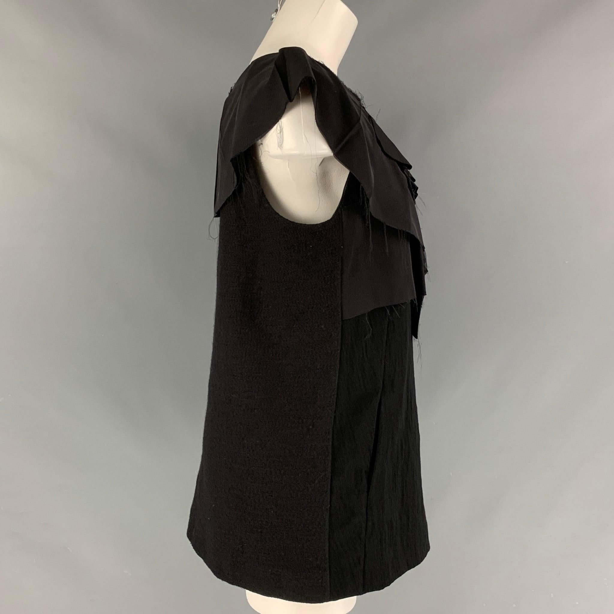MARNI sleeveless v-neck blouse comes in a black wool and nylon featuring frontal pockets and ruffled detail at collar. Made in Italy.Excellent Pre-Owned Condition. 
 

 Marked:  44 
 

 Measurements: 
  
 Shoulder: 15 inches Bust: 38 inches Length: