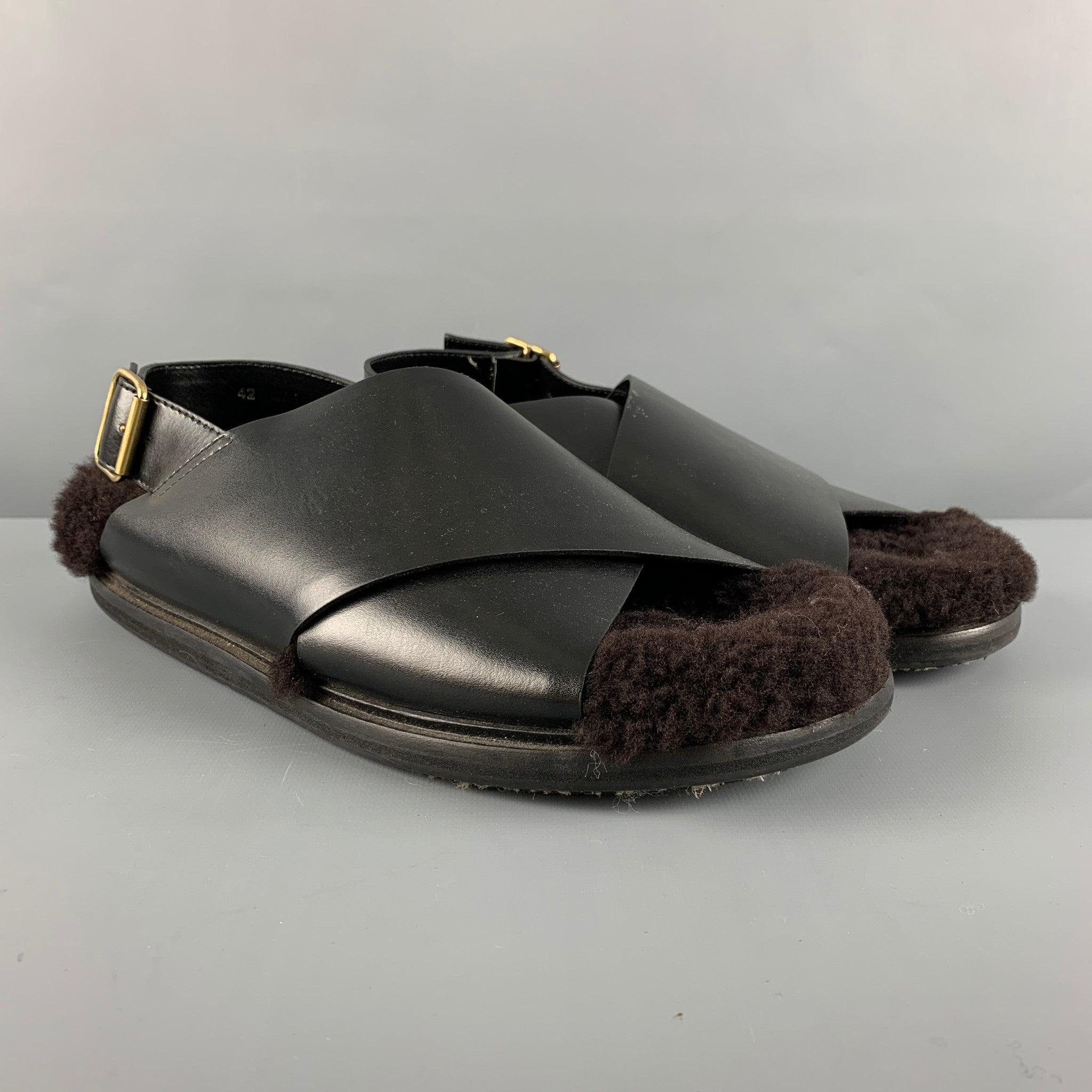 MARNI sandals comes in a black leather material featuring a faux fur top detail, crossover strap design, and sling back closure. Made in Italy.Very Good Pre-Owned Condition. 

Marked:   42Outsole: 12 inches  x 5 inches   
  
  
 
Reference: