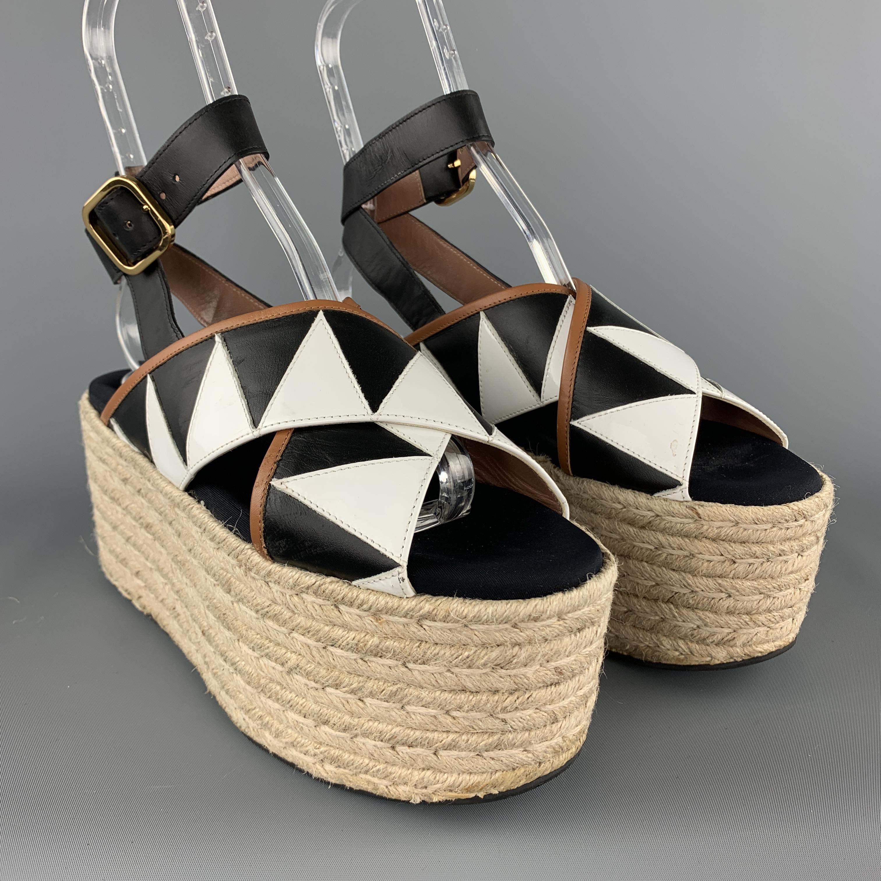 MARNI sandals feature black and white color block cross straps, ankle harness, and chunky braided espadrille platform sole. Made in Italy.

Excellent Pre-Owned Condition.
Marked: IT 39

Measurements:

Heel: 3.5 in.
Platform: 3.5 in.