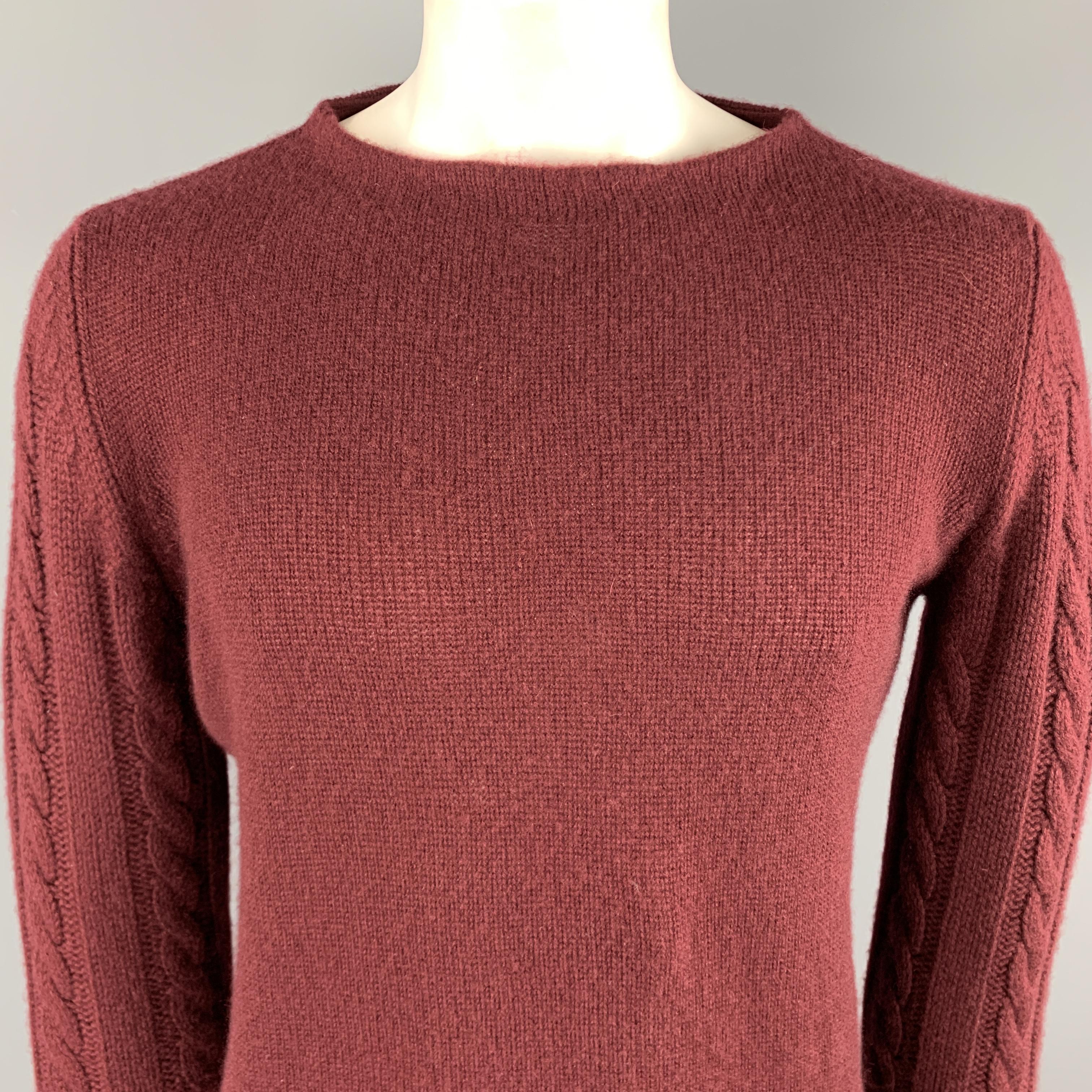 MARNI pullover sweater comes in a burgundy cashmere featuring cable knit sleeves and a boat neck. Made in Italy.

Excellent Pre-Owned Condition.
Marked: IT 52

Measurements:

Shoulder: 18 in. 
Chest: 50 in.
Sleeve: 32 in.
Length: 26 in. 

