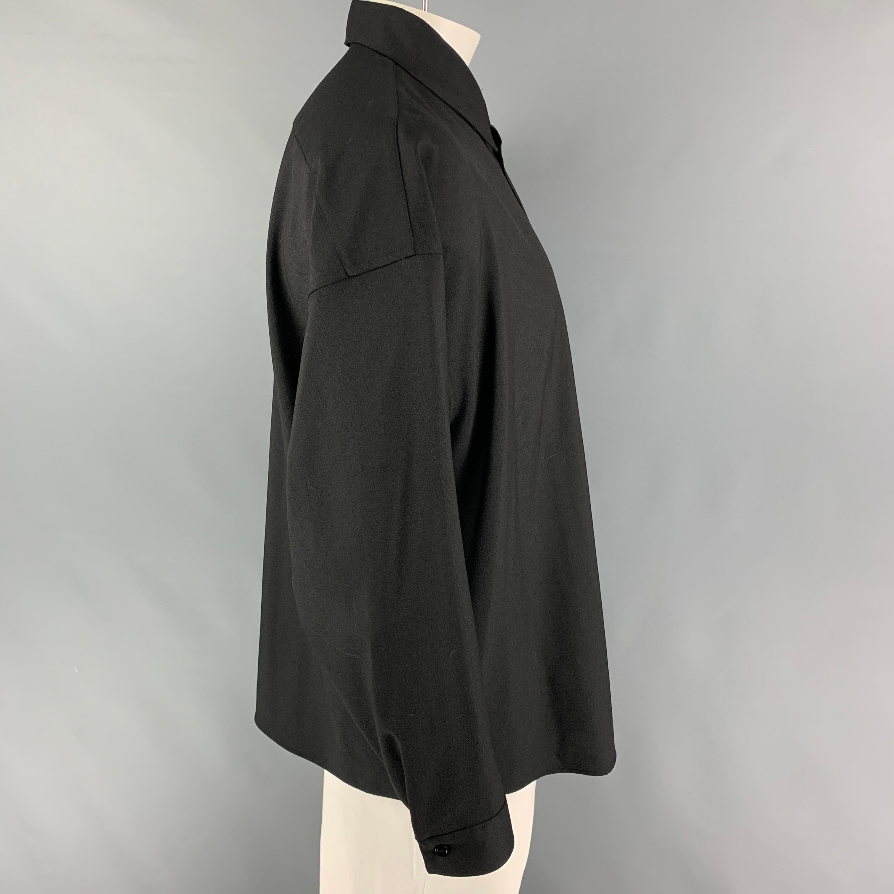 MARNI long sleeve shirt comes in a black virgin wool featuring a oversized fit, pointed collar, patch pocket, and a button up closure. Made in Italy.

Very Good Pre-Owned Condition.
Marked: 50

Measurements:

Shoulder: 27.5 in.
Chest: 54 in.
Sleeve: