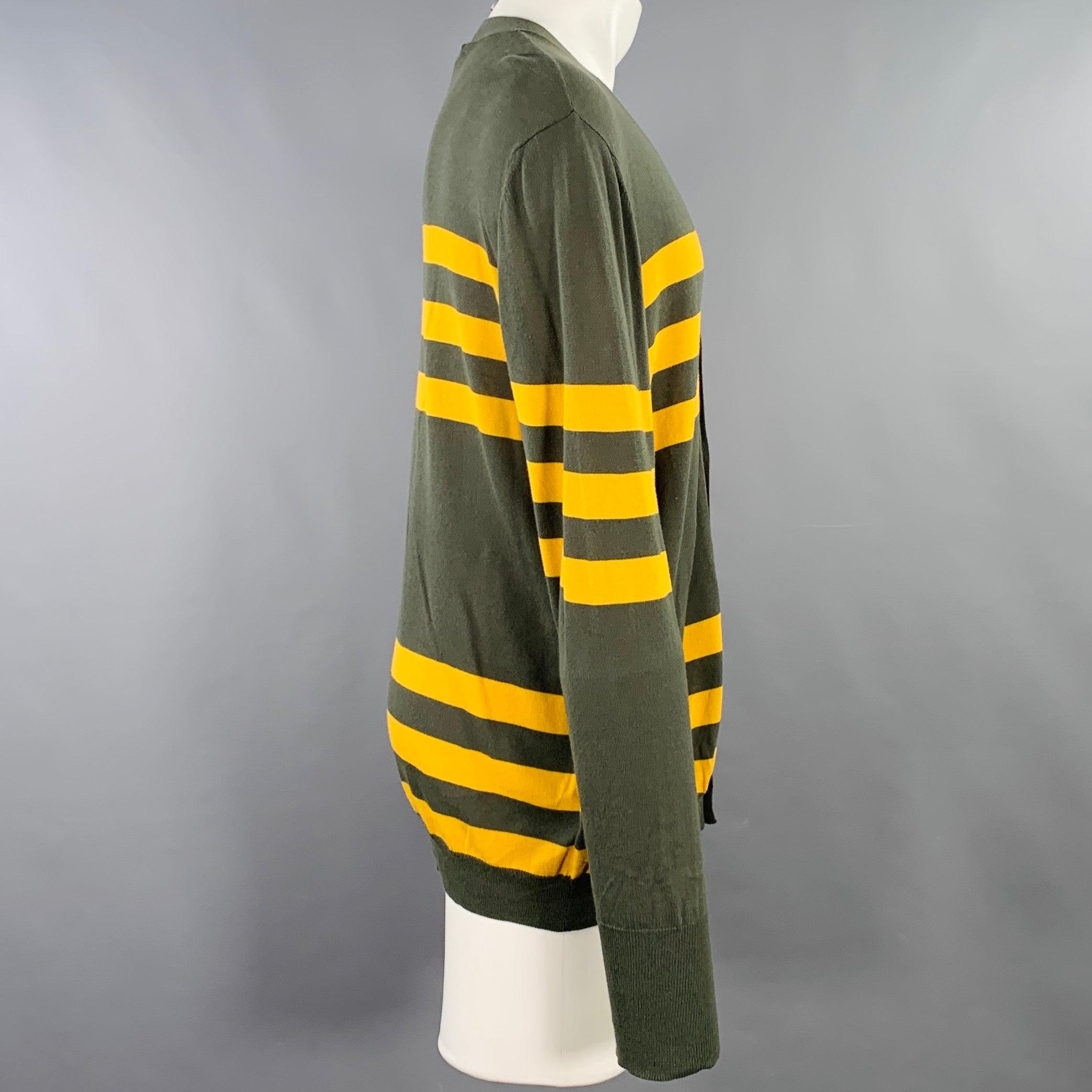 MARNI cardigan
in a green and yellow cotton jersey featuring stripe details, V-neck, and button closure. Made in Italy.Excellent Pre-Owned Condition. 

Marked:   IT 50 

Measurements: 
 
Shoulder: 20.5 inches Chest: 50 inches Sleeve: 28 inches