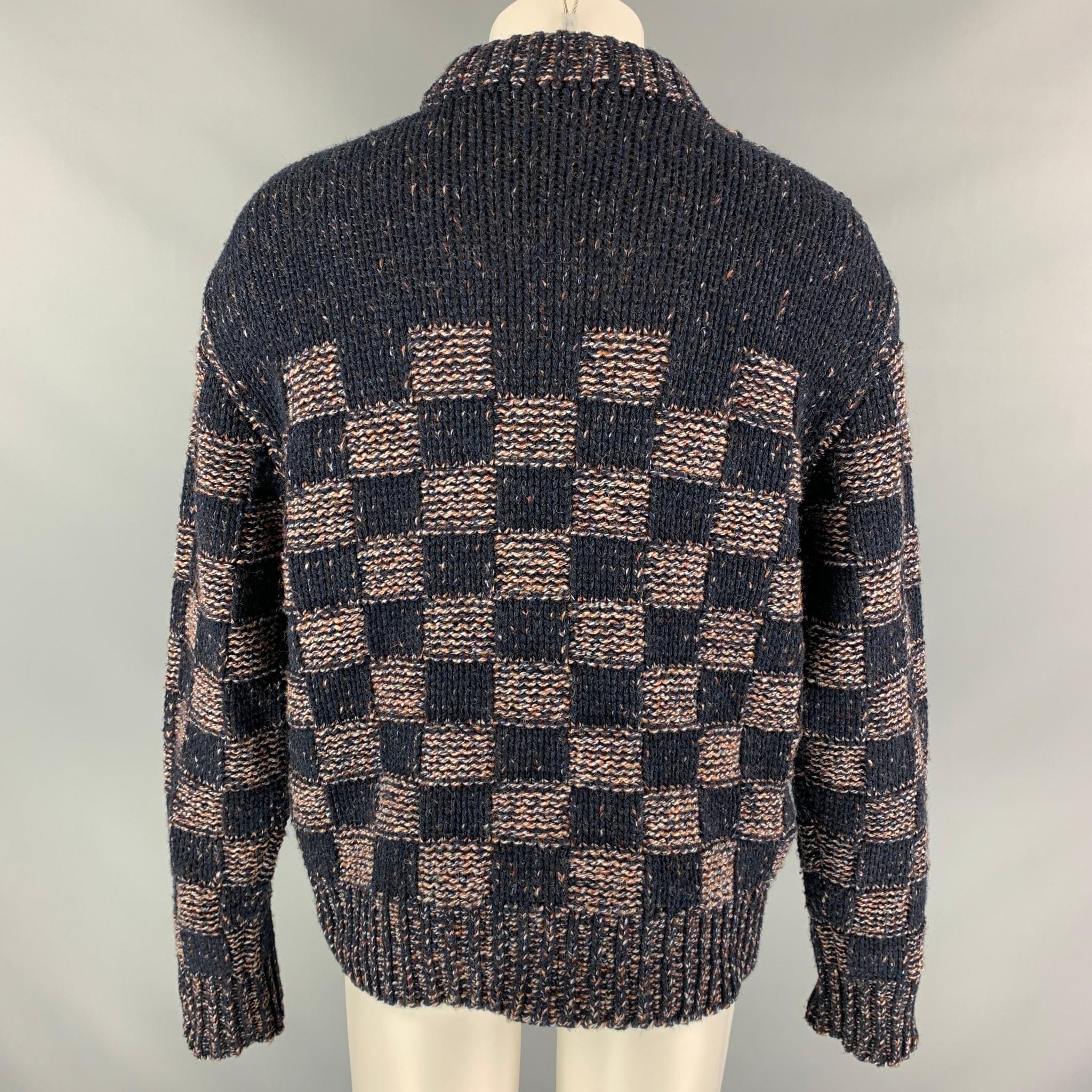 MARNI sweater comes in a navy & brick checkered print wool featuring a oversized fit and crew-neck. Made in Italy.

Very Good Pre-Owned Condition.
Marked: 46

Measurements:

Shoulder: 22.5 in.
Chest: 46 in.
Sleeve: 27.5 in.
Length: 26.5 in. 

SKU: