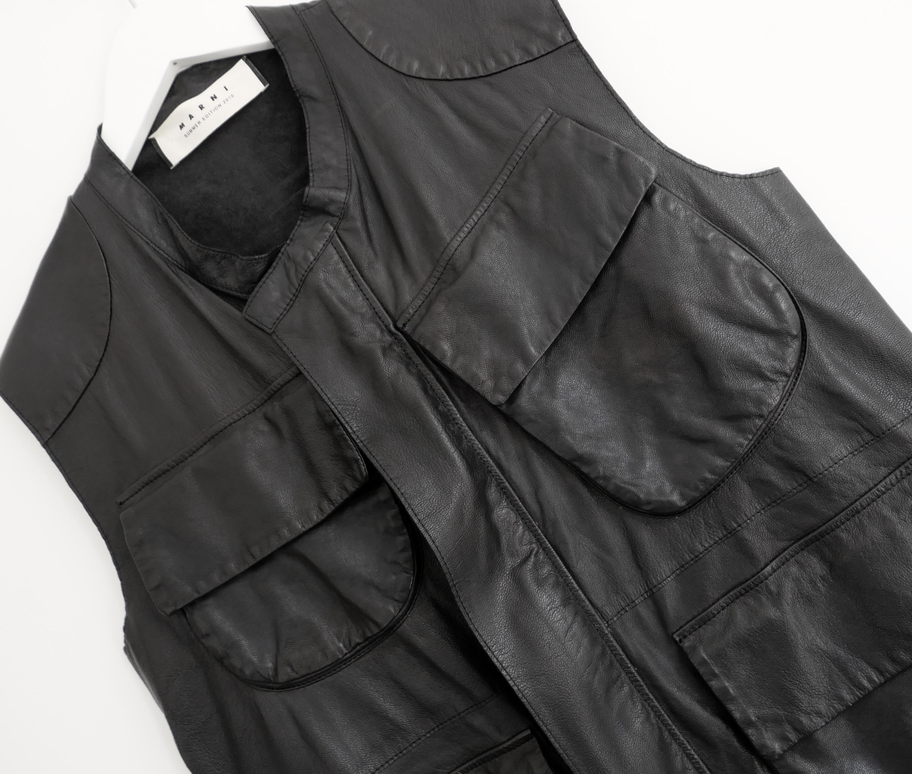 Gorgeous archival Marni leather sleeveless jacket. From the Spring 2010 collection and unworn with fabric info tag attached inside. Made from soft black goat leather, it has a longing cut with cargo jacket inspired asymmetric feature pockets and