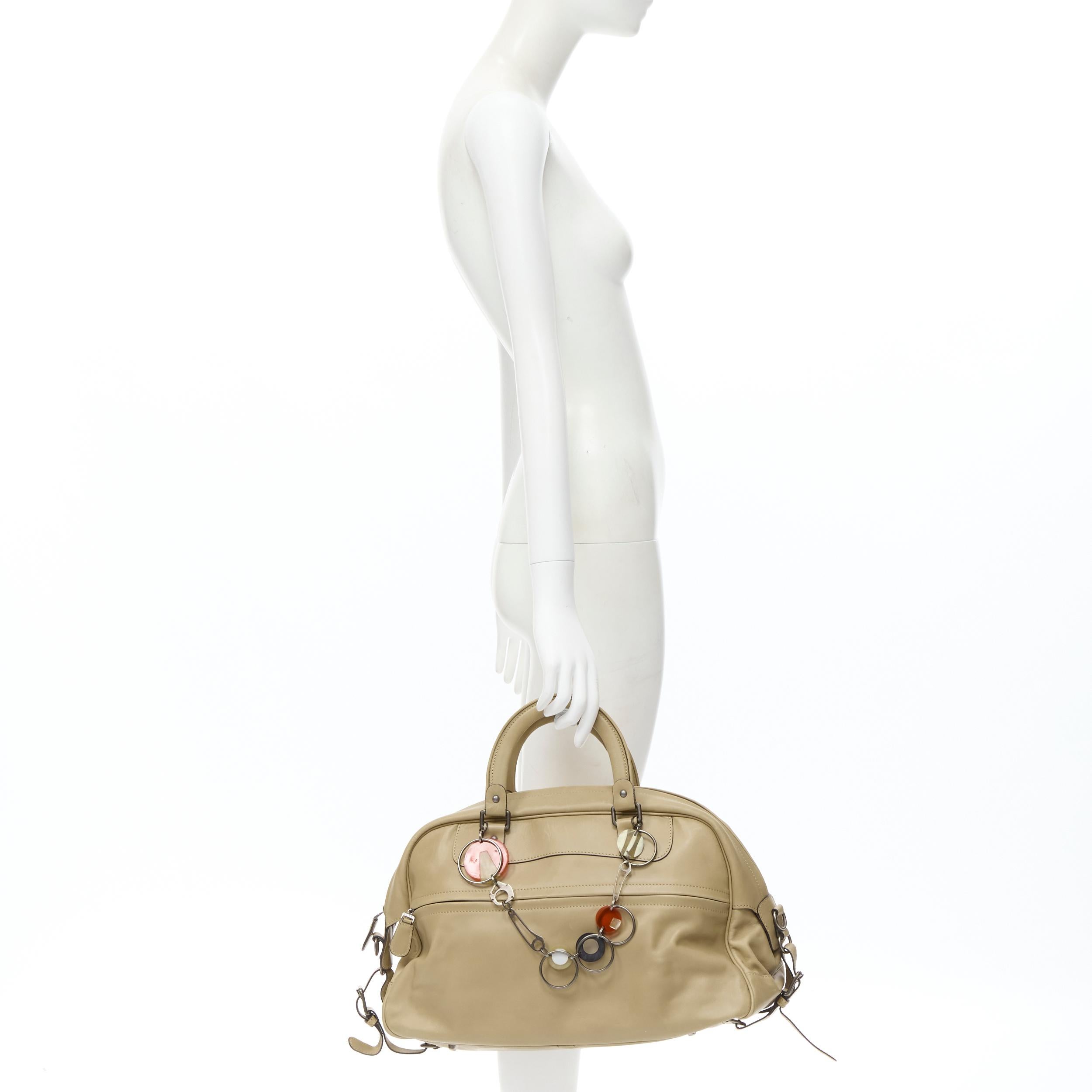 MARNI tan brown leather resin metal chain large weekend bowling boston bag 
Reference: CELG/A00024 
Brand: Marni 
Model: Weekender bowling bag 
Material: Leather 
Color: Brown 
Pattern: Solid 
Closure: Zip 
Extra Detail: Decorative chain