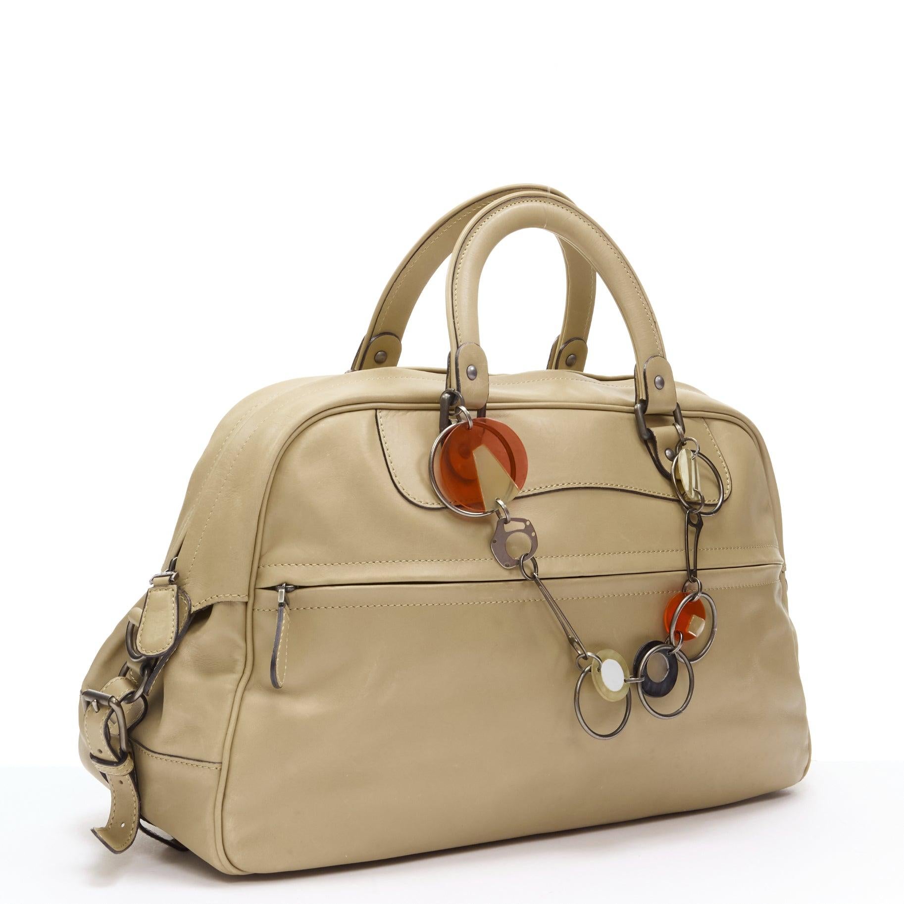 MARNI tan brown leather resin metal chain large weekend bowling boston bag
Reference: CELG/A00024
Brand: Marni
Model: Weekender bowling bag
Material: Leather
Color: Brown
Pattern: Solid
Closure: Zip
Lining:  Fabric
Extra Details: Decorative chain
