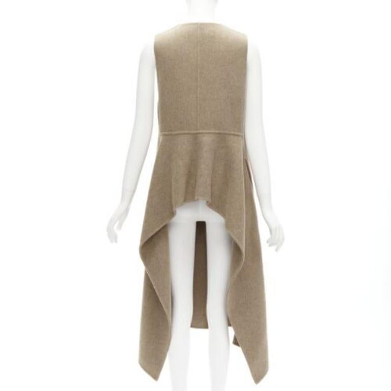 MARNI taupe braun Schurwolle Mischung hoch niedrig Saum Weste Mantel IT36 XS
Aktenzeichen: CELG/A00248
Marke: Marni
MATERIAL: Schurwolle, Gemisch
Farbe: Braun
Muster: Solide
Verschluss: Knopf
Zusätzliche Details: Versteckte Knöpfe. Umgekehrter