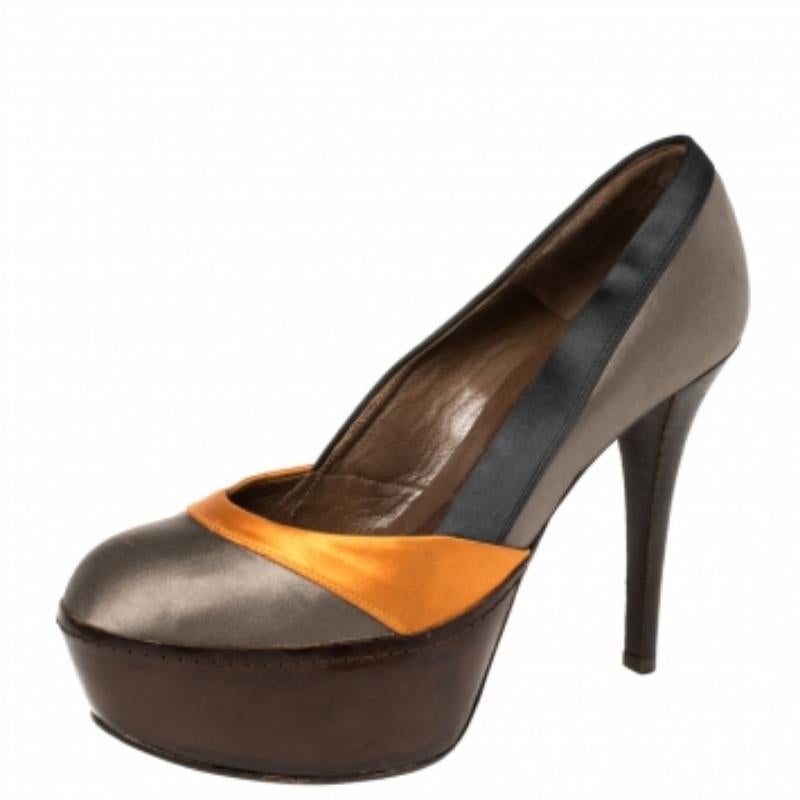 Stand tall and in style with this pair of pumps from Marni. Crafted from tricolor satin, the pumps feature covered toes, platforms, and 12 cm heels. Style the pair with dresses, suits, or chic casuals.