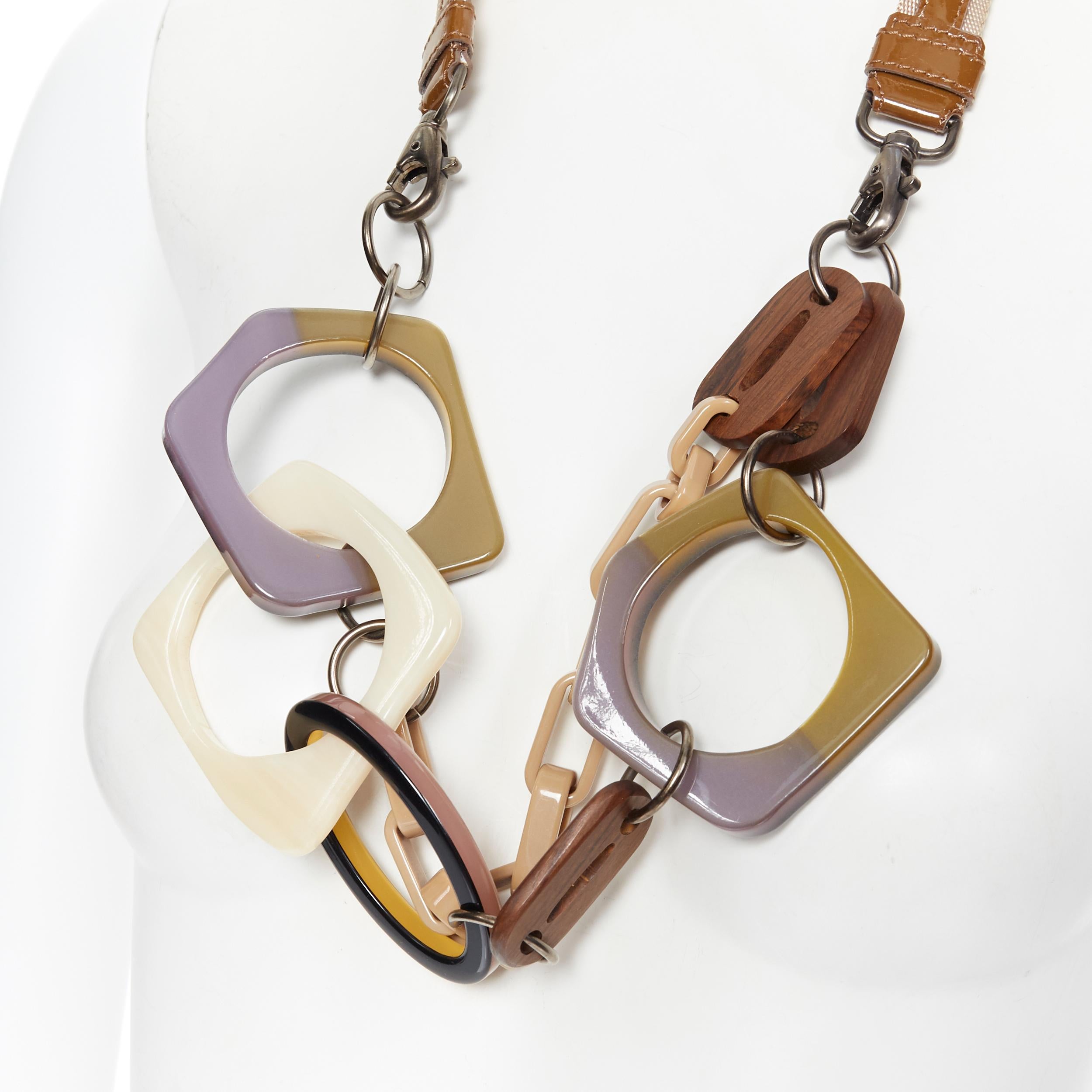 MARNI tribal resin looped bangle wooden loop patent strap statement necklace
Brand: Marni
Designer: Marni
Model Name / Style: Statement necklace
Material: Resin
Color: Multicolour
Pattern: Solid
Closure: Lobster 
Made in: Italy

CONDITION: