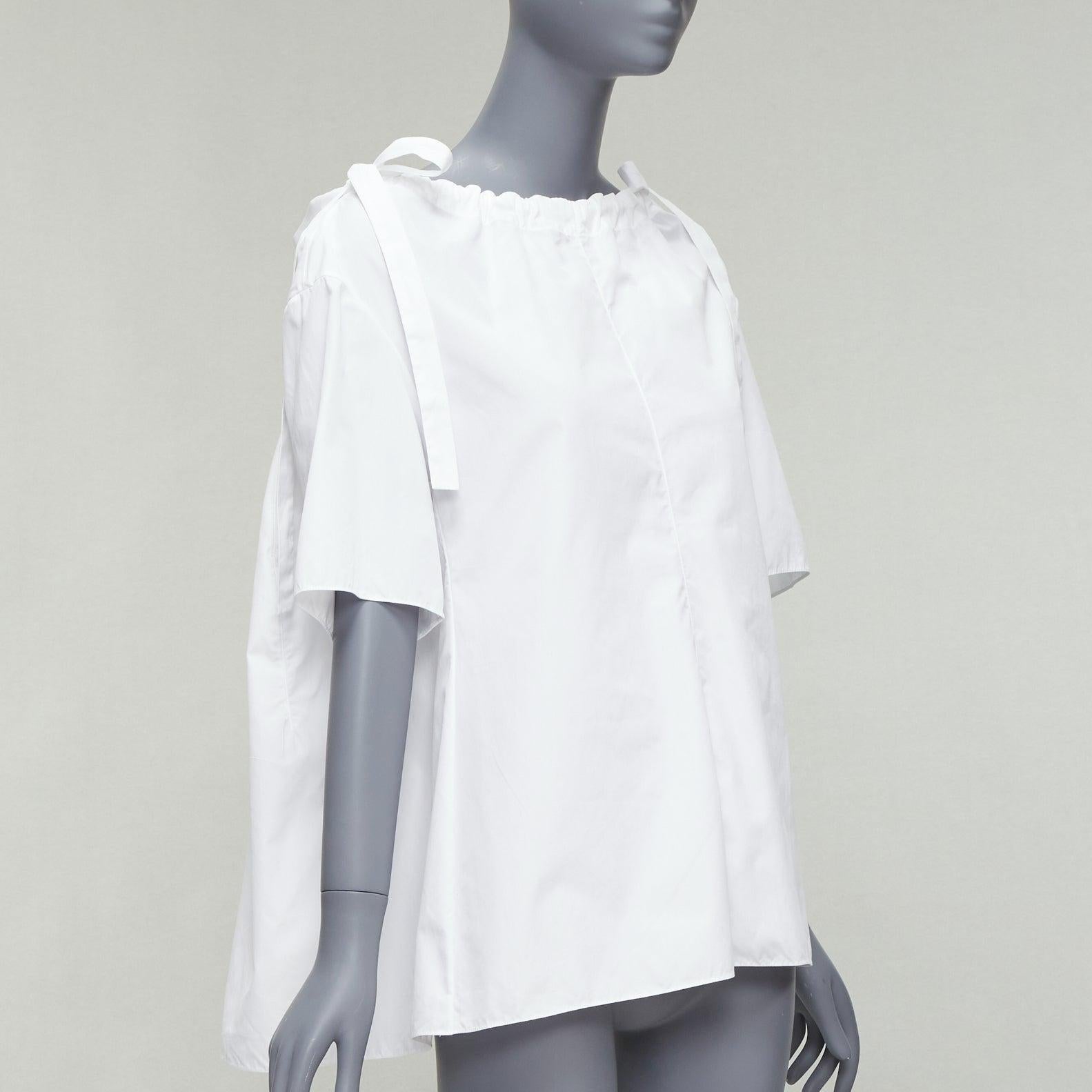 MARNI white 100% cotton side drawstring collar trapeze top IT38 XS
Reference: CELG/A00328
Brand: Marni
Material: Cotton
Color: White
Pattern: Solid
Closure: Drawstring
Extra Details: White drawstring collar design.
Made in: