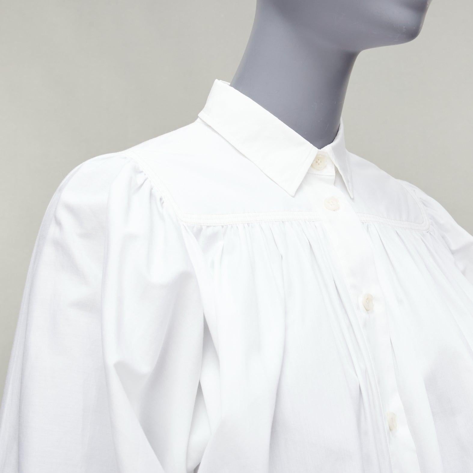 MARNI white cotton drawstring hem puff sleeve cropped blouse IT36 XXS
Reference: CELG/A00332
Brand: Marni
Material: Cotton
Color: White
Pattern: Solid
Closure: Button
Extra Details: Dolman sleeves. Back yoke.
Made in: Turkey

CONDITION:
Condition: