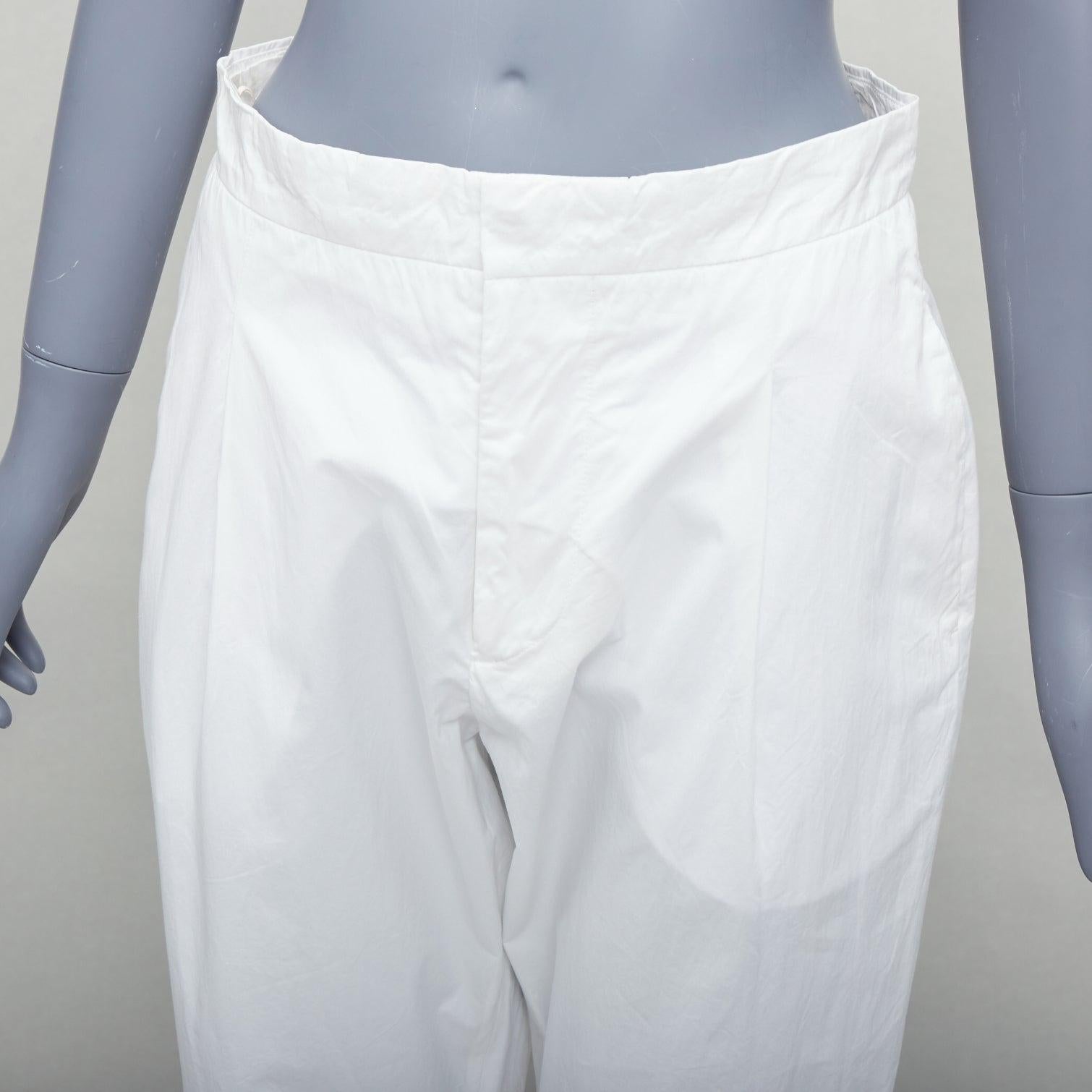 MARNI white cotton pleated front high waist cropped pants IT38 XS
Reference: CELG/A00435
Brand: Marni
Material: Cotton
Color: White
Pattern: Solid
Closure: Zip Fly
Extra Details: Back pockets.
Made in: Italy

CONDITION:
Condition: Very good, this