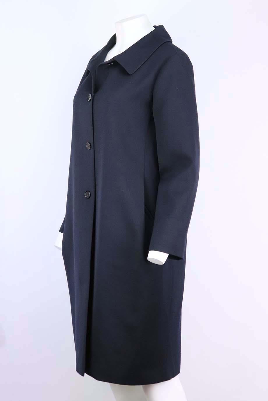 This coat by Marni has been tailored from textured wool-blend, so it'll keep you looking particularly sharp during the transitional months, cut in a loose, longline silhouette. Navy wool-blend. Button fastening at front. 52% Polyester, 48% wool.