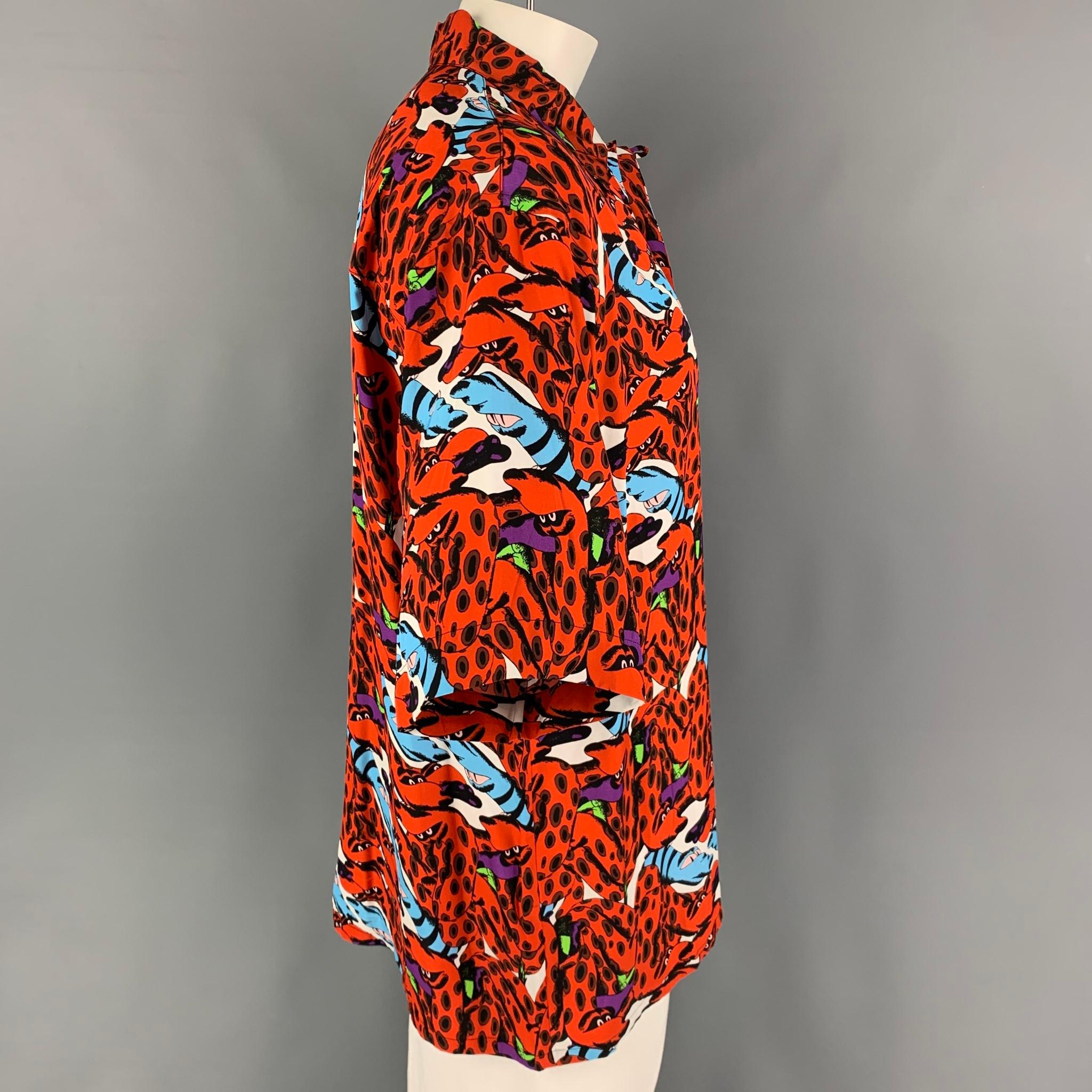 MARNI x BRUNO B BONETTO short sleeve shirt comes in a orange & black print  viscose featuring a camp collar, patch pocket, and a button up closure. Made in Italy. 

Excellent Pre-Owned Condition.
Marked: 50

Measurements:

Shoulder: 22 in.
Chest: 50