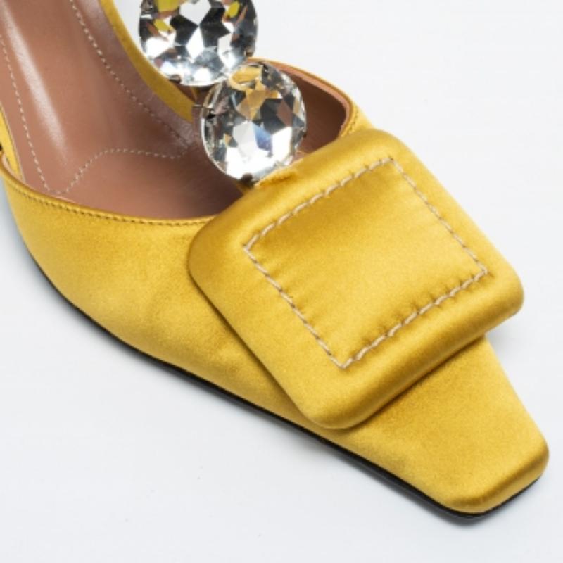 These pumps from the House of Marni will certainly make you look classy and polished! They are created using yellow satin and display a crystal-embellished T-strap. They showcase 5.5 cm heels, pointed toes, and silver-tone hardware. Look gorgeous as