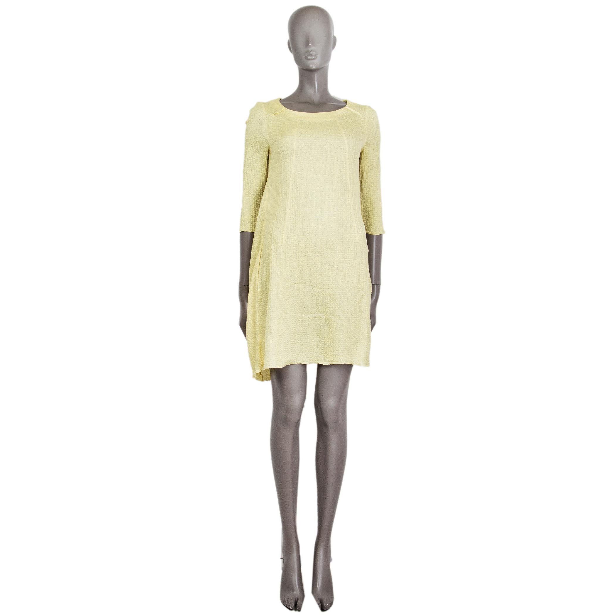 100% authentic Marni textured shift dress in lemon yellow silk (58%) and linen (42%). With 3/4 sleeves, draped puckering and pleating on the back, and two slit pockets on the side. Unlined. Has been worn and is in excellent condition.