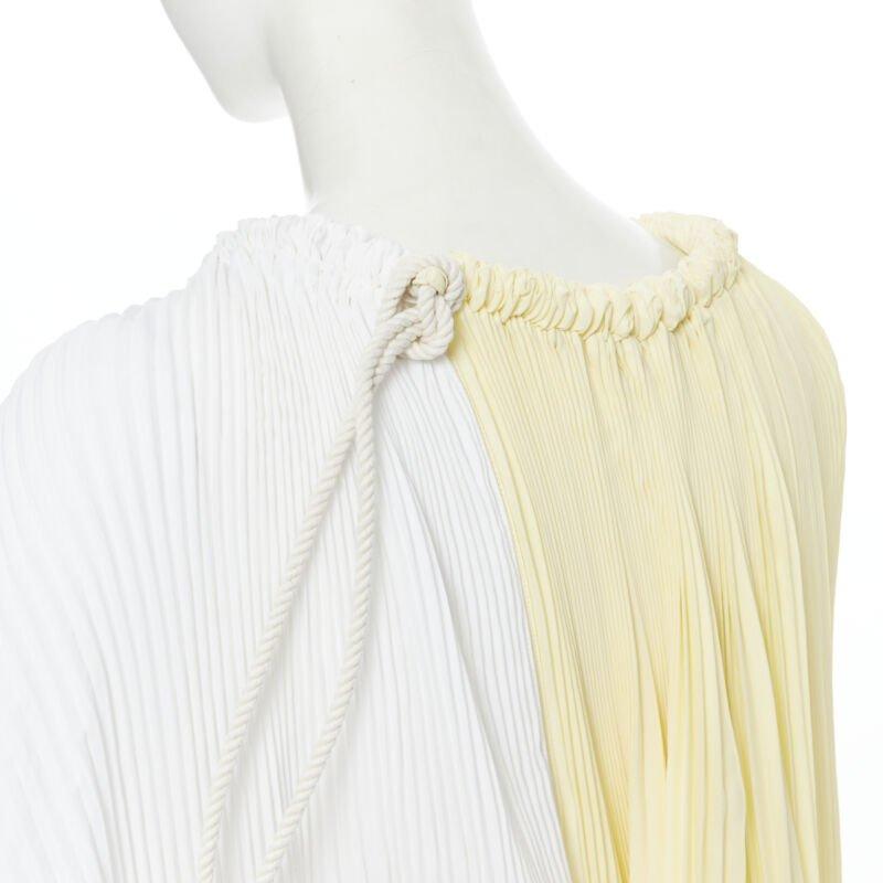 MARNI yellow white knife pleat stringed cord open back voluminous top IT40 S
Reference: AEMA/A00034
Brand: Marni
Material: Polyester
Color: Yellow, White
Pattern: Solid
Extra Details: Waxed cord stringed to give volume and weight to fabric.