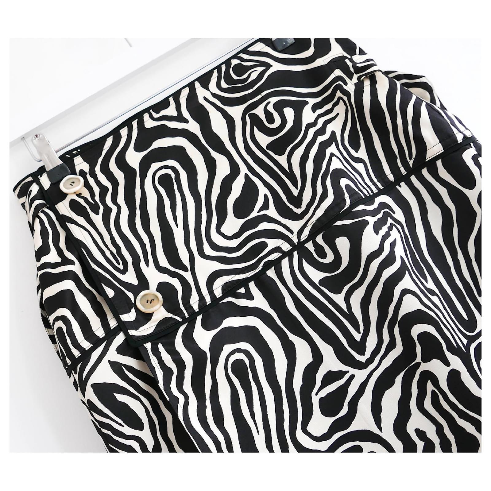 Arty cool Marni zebra print midi skirt - bought for £895 and worn twice. Has been newly dry cleaned. Made from thick, smooth viscose sateen, it has a low sitting, wrap cut with chunky button and popper fastening and long d ring straps to each side.